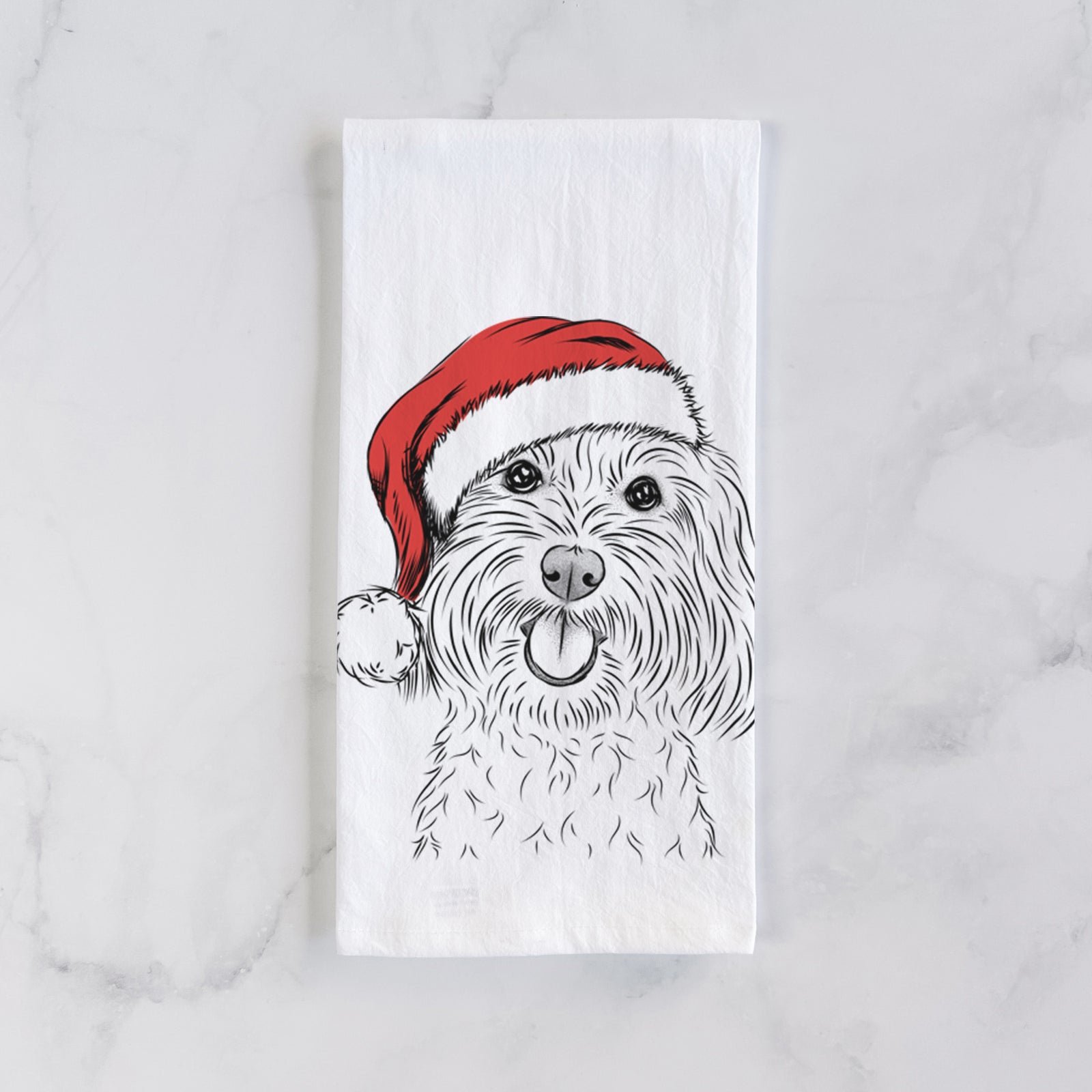 Hand-drawn sketch of Cuddles the Coton de Tulear wearing a Santa hat on a tea towel