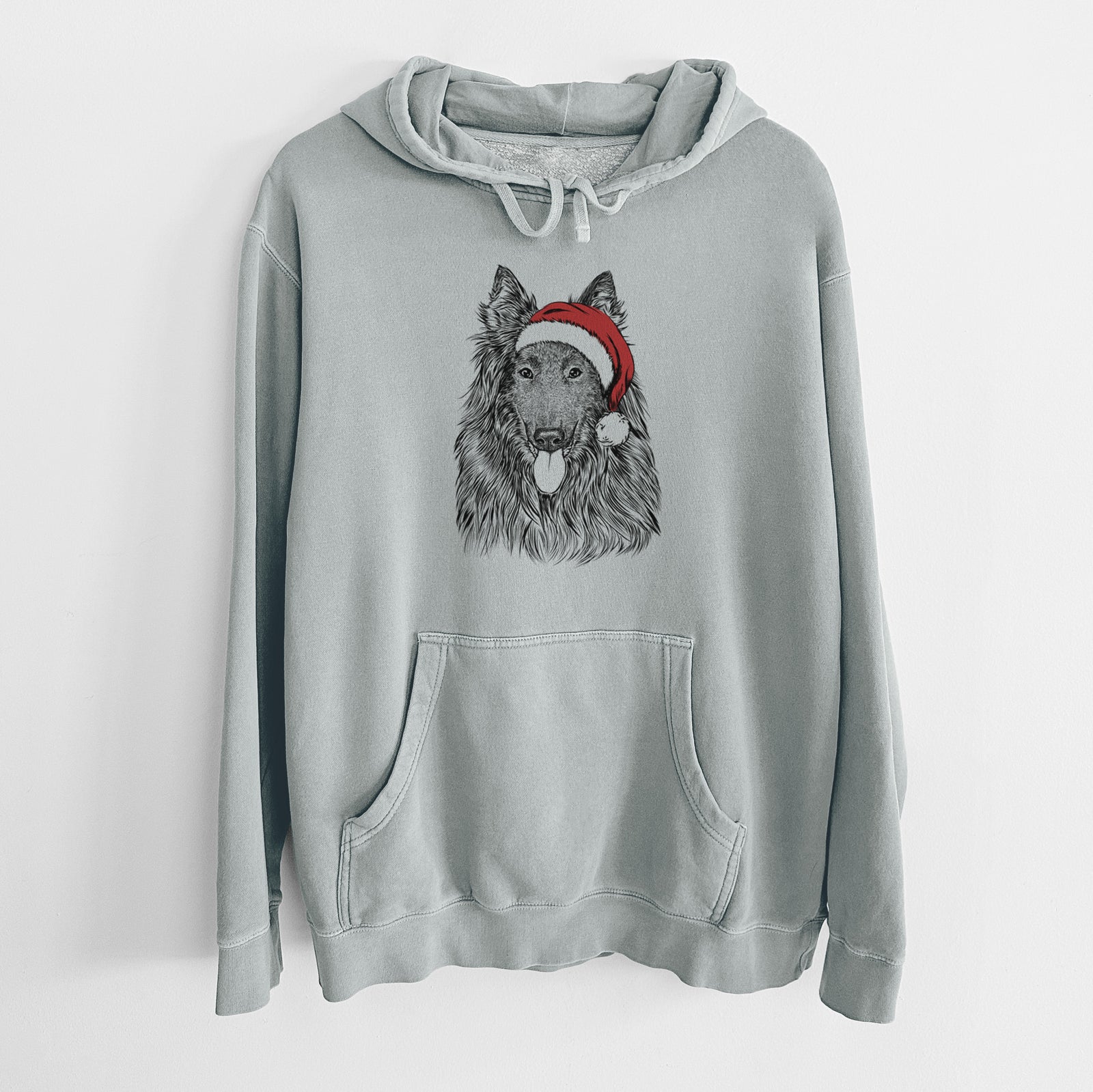 Hand-drawn sketch of Daan the Belgian Shepherd wearing a Santa hat on a Sage Unisex pigment dyed hoodie