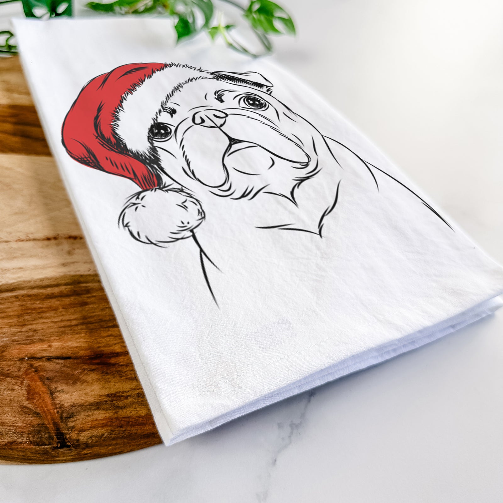 Hand-drawn sketch of Darling Chloe the Pug wearing a Santa hat on a tea towel