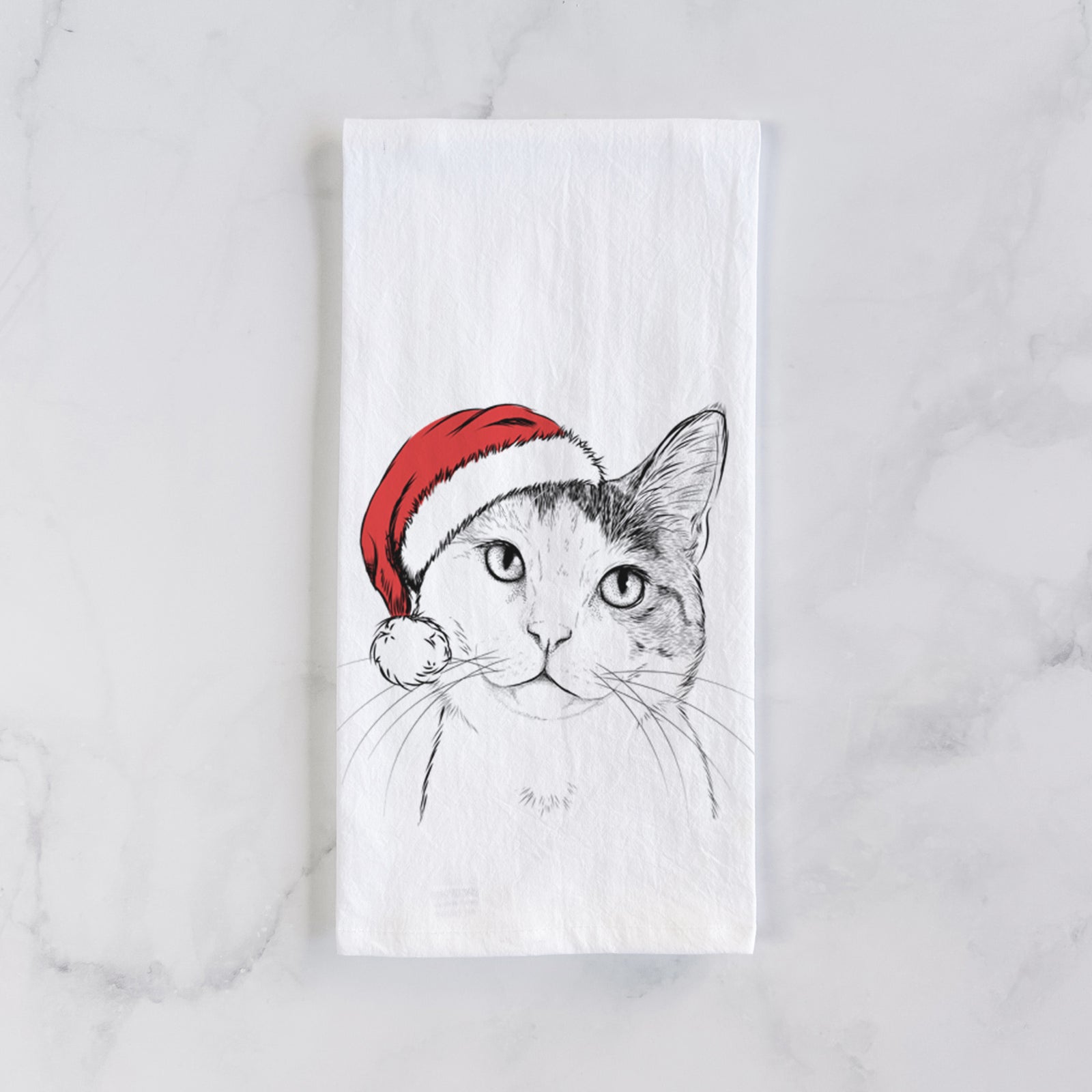 Hand-drawn sketch of Denver the Calico Cat wearing a Santa hat on a tea towel