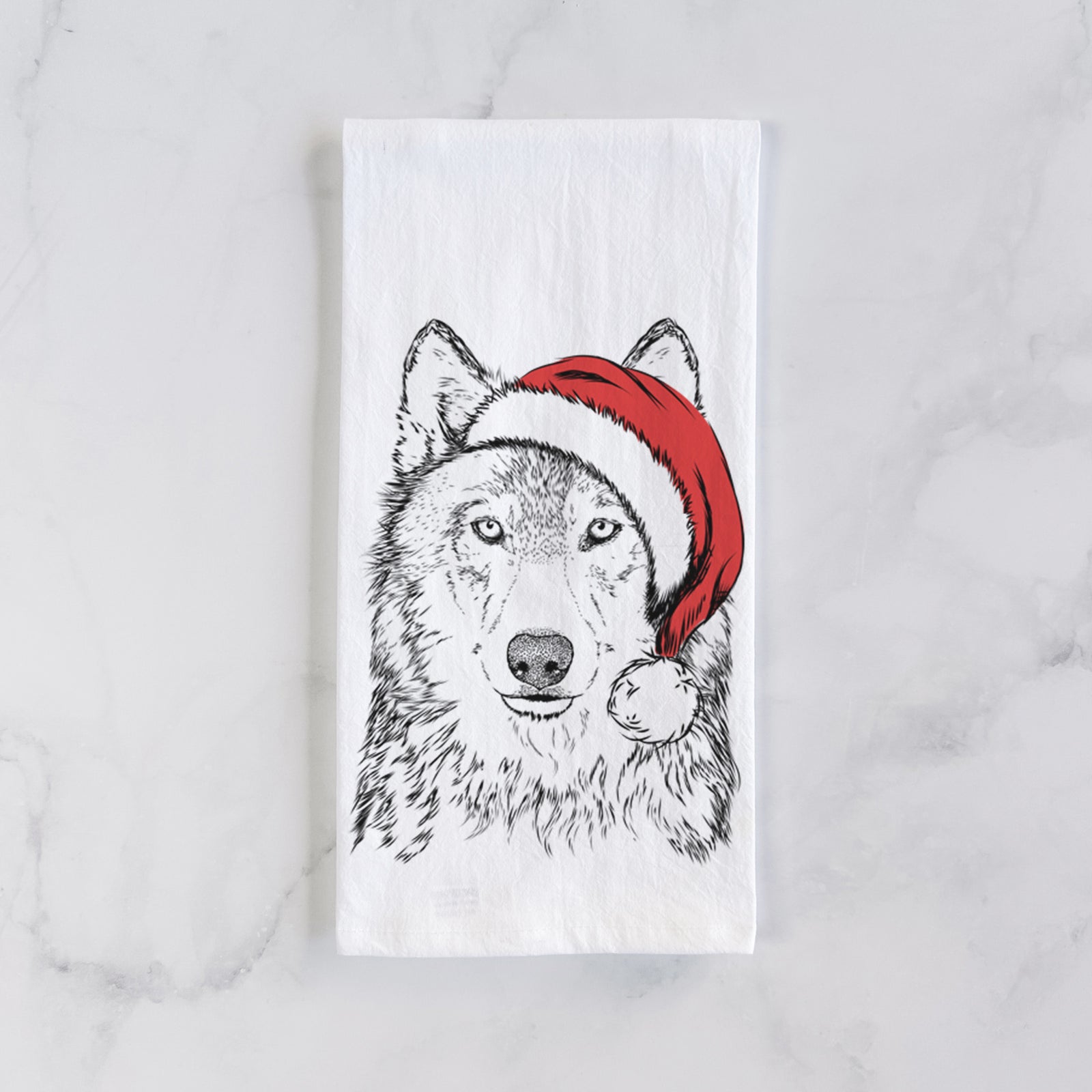 Hand-drawn sketch of Django the Grey Wolf wearing a Santa hat on a tea towel