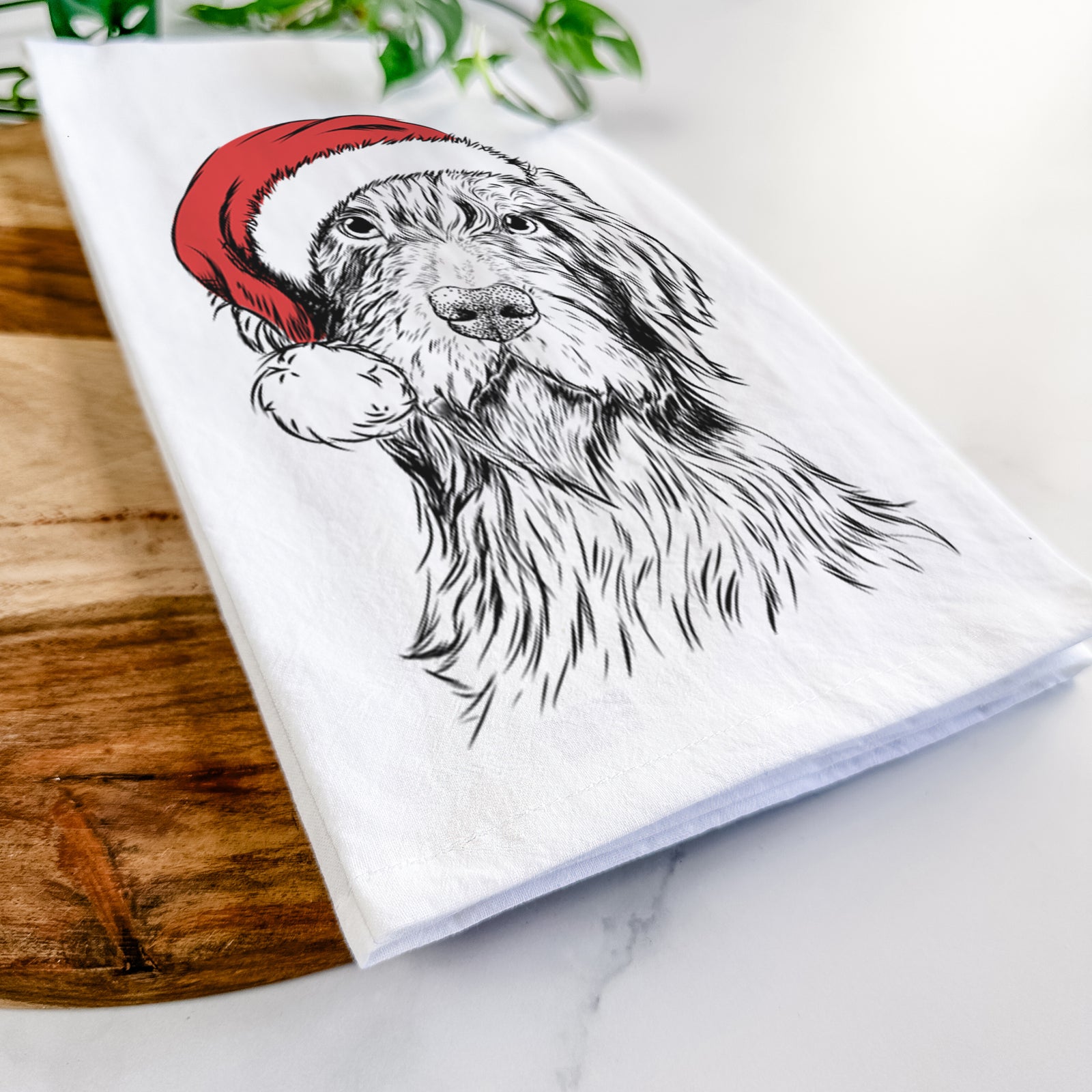Hand-drawn sketch of Doc Holliday the Pudelpointer wearing a Santa hat on a tea towel