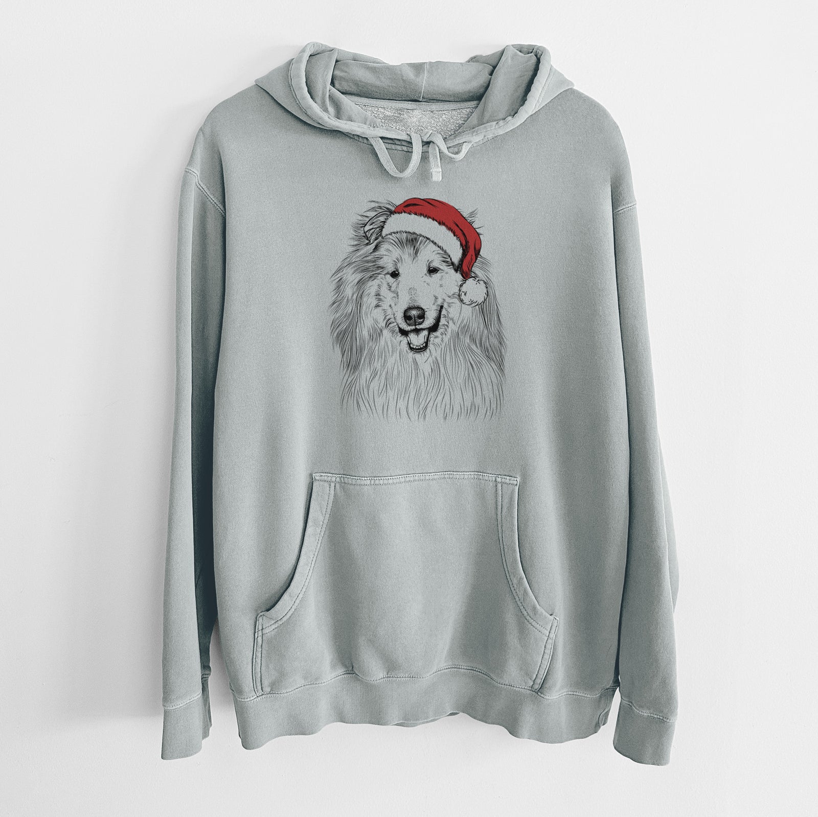 Hand-drawn sketch of Donnan the Rough Collie wearing a Santa hat on a Sage Unisex pigment dyed hoodie