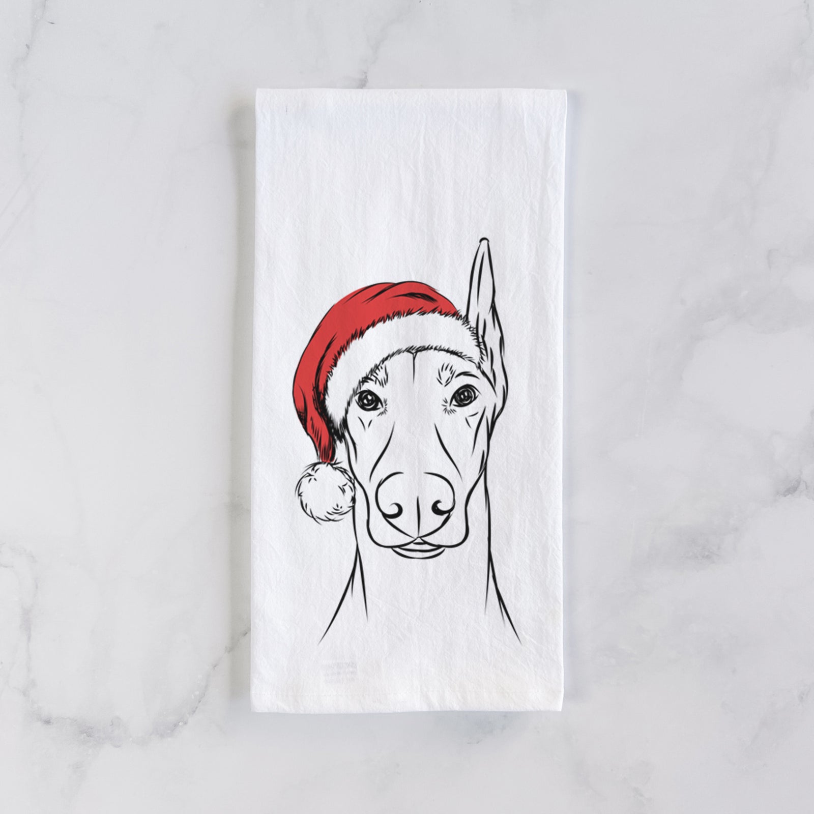Hand-drawn sketch of Duke the Doberman Pinscher wearing a Santa hat on a tea towel