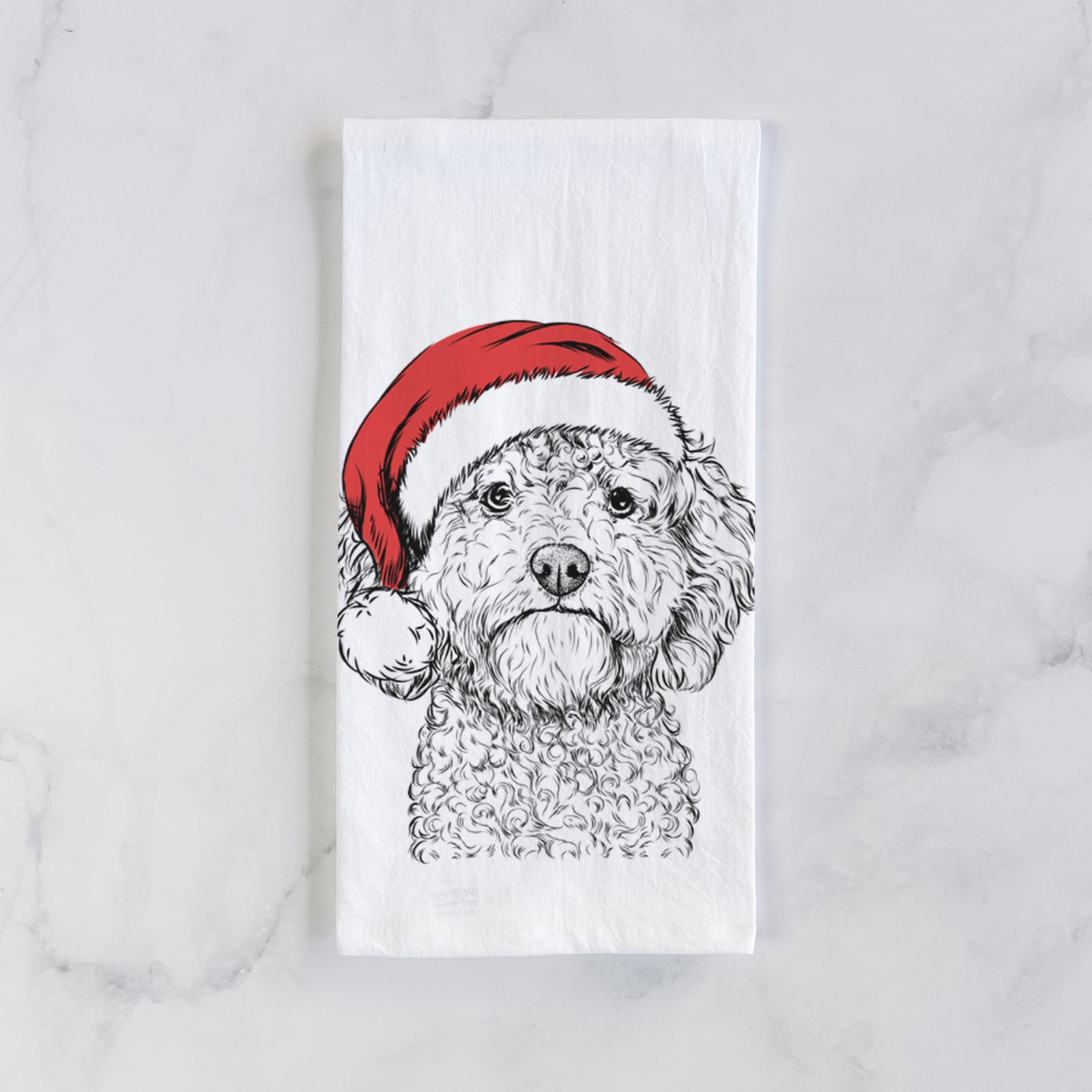 Hand-drawn sketch of Edgar the Shihpoo wearing a Santa hat on a tea towel