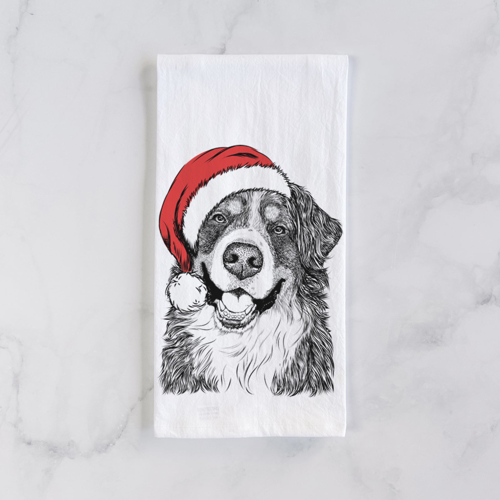 Hand-drawn sketch of Eiger the Bernese Mountain Dog wearing a Santa hat on a tea towel