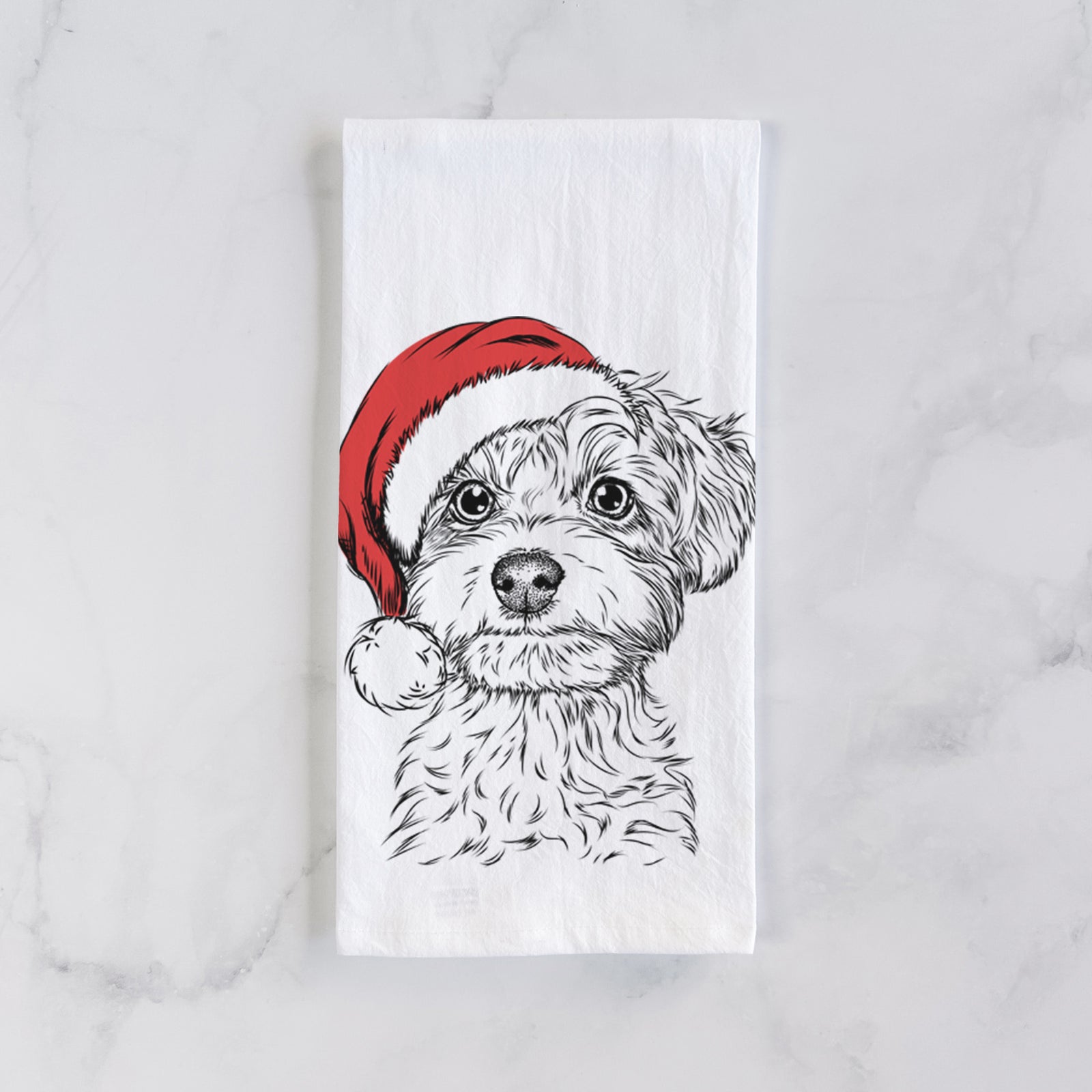 Hand-drawn sketch of Elliott the Yorkiepoo wearing a Santa hat on a tea towel