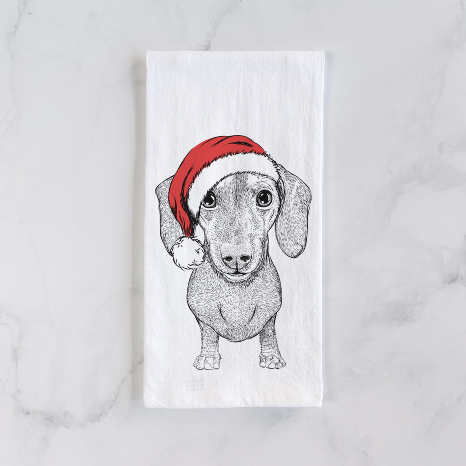 Hand-drawn sketch of Ernie the Mini Dachshund wearing a Santa hat on a tea towel