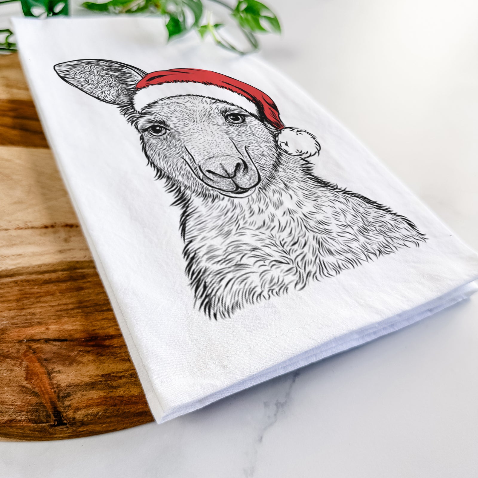 Hand-drawn sketch of Evelyn the Eastern Grey Kangaroo wearing a Santa hat on a tea towel