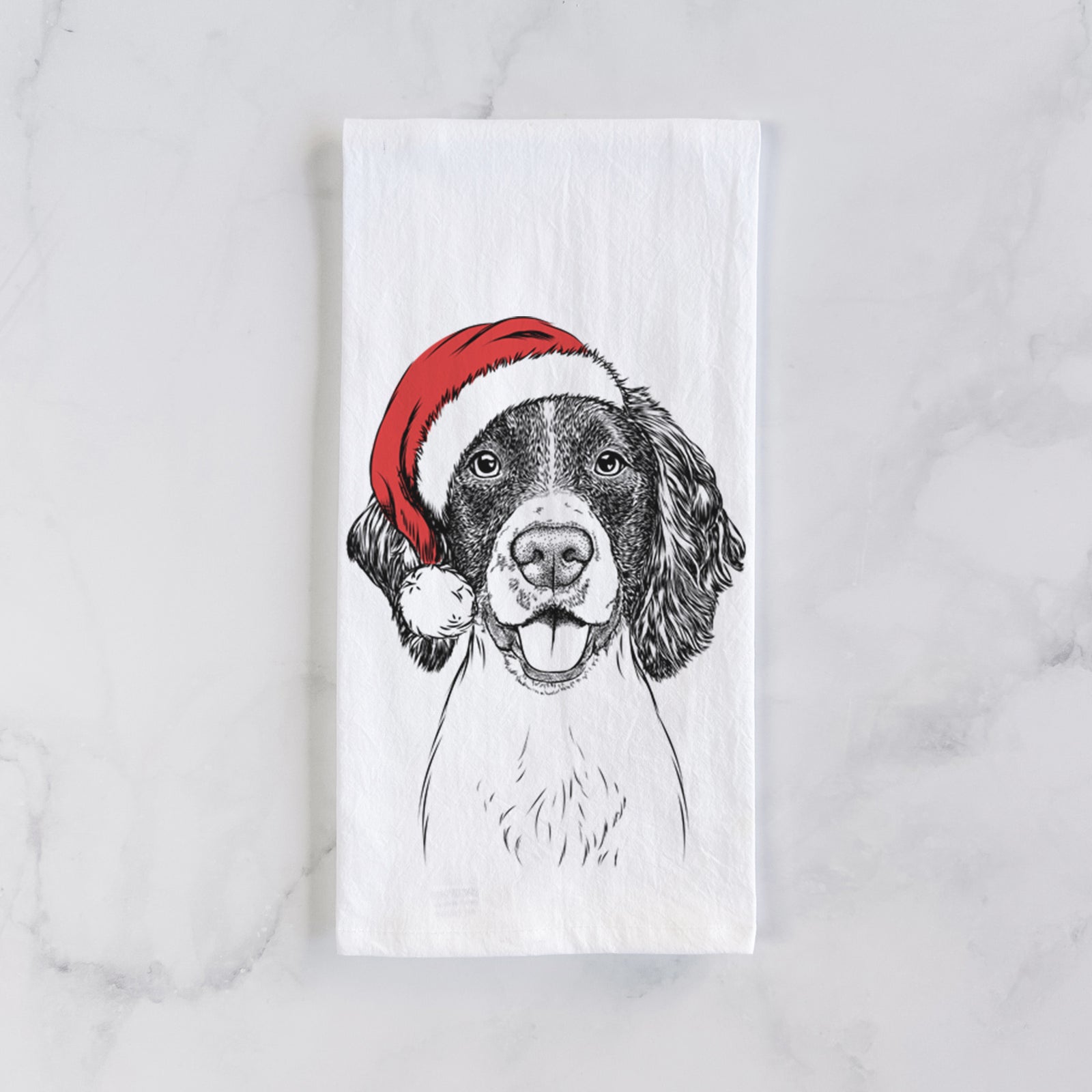 Hand-drawn sketch of Ever the English Springer Spaniel wearing a Santa hat on a tea towel