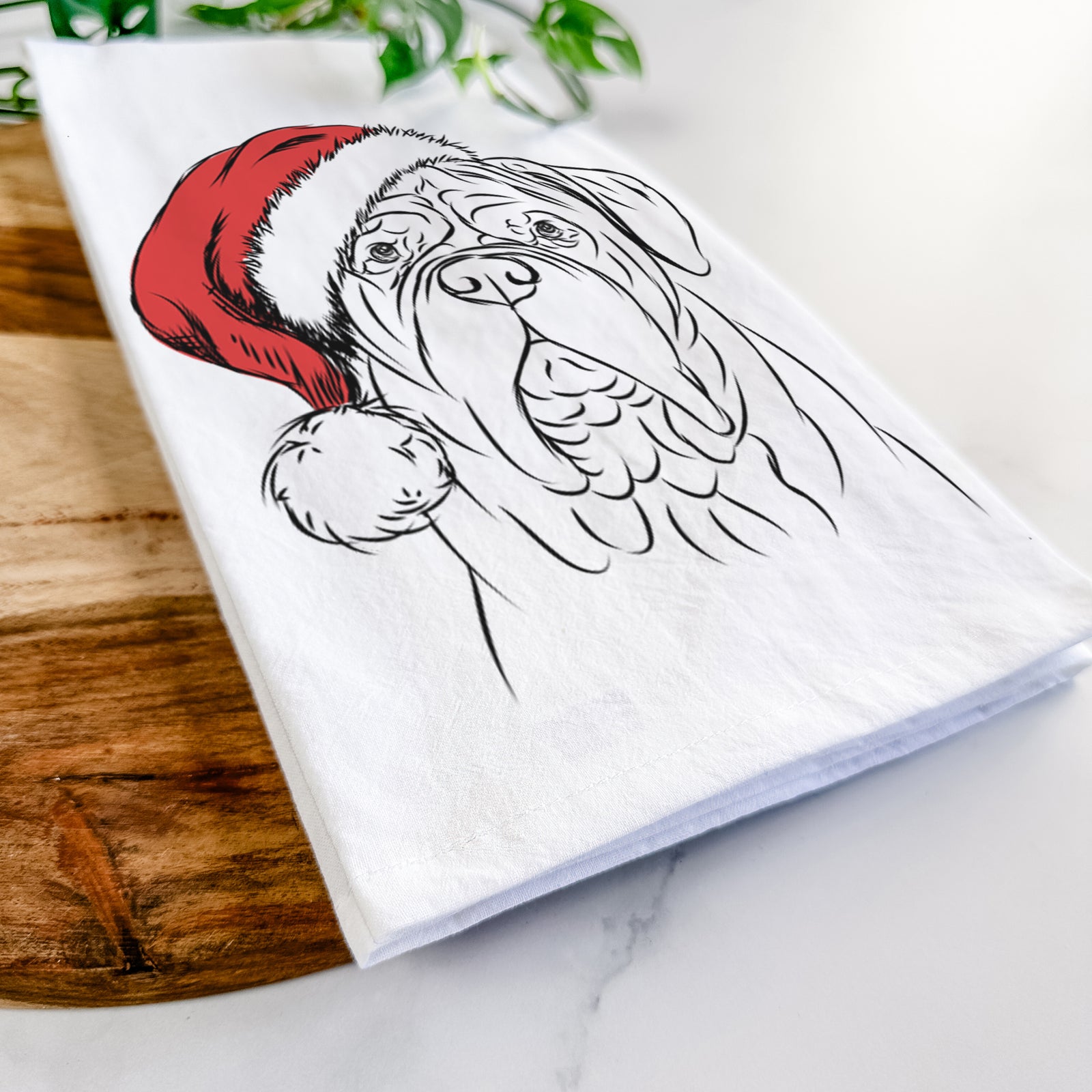 Hand-drawn sketch of Felix the Dogue de Bordeaux wearing a Santa hat on a tea towel