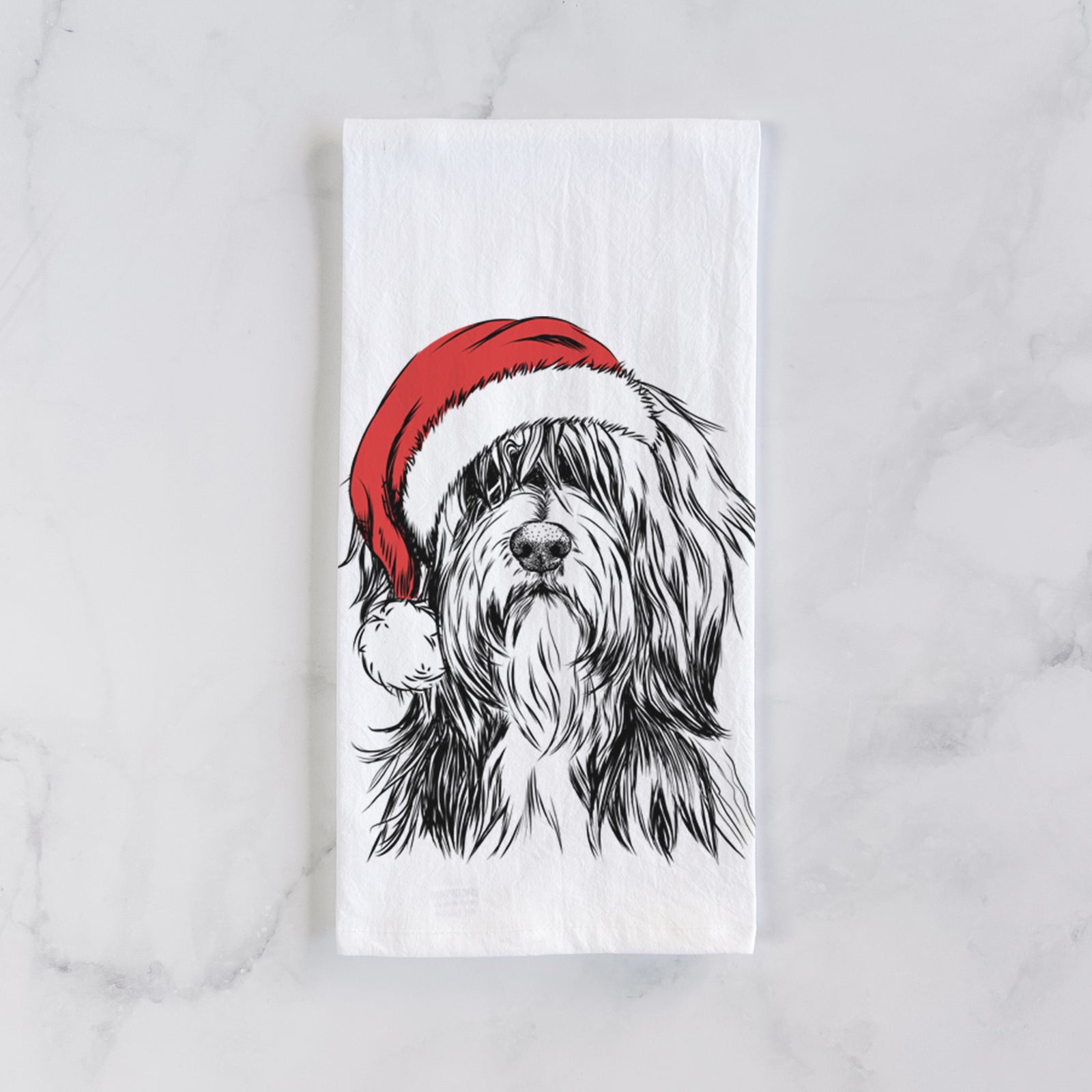 Hand-drawn sketch of Fiji the Polish Lowland Sheepdog wearing a Santa hat on a tea towel