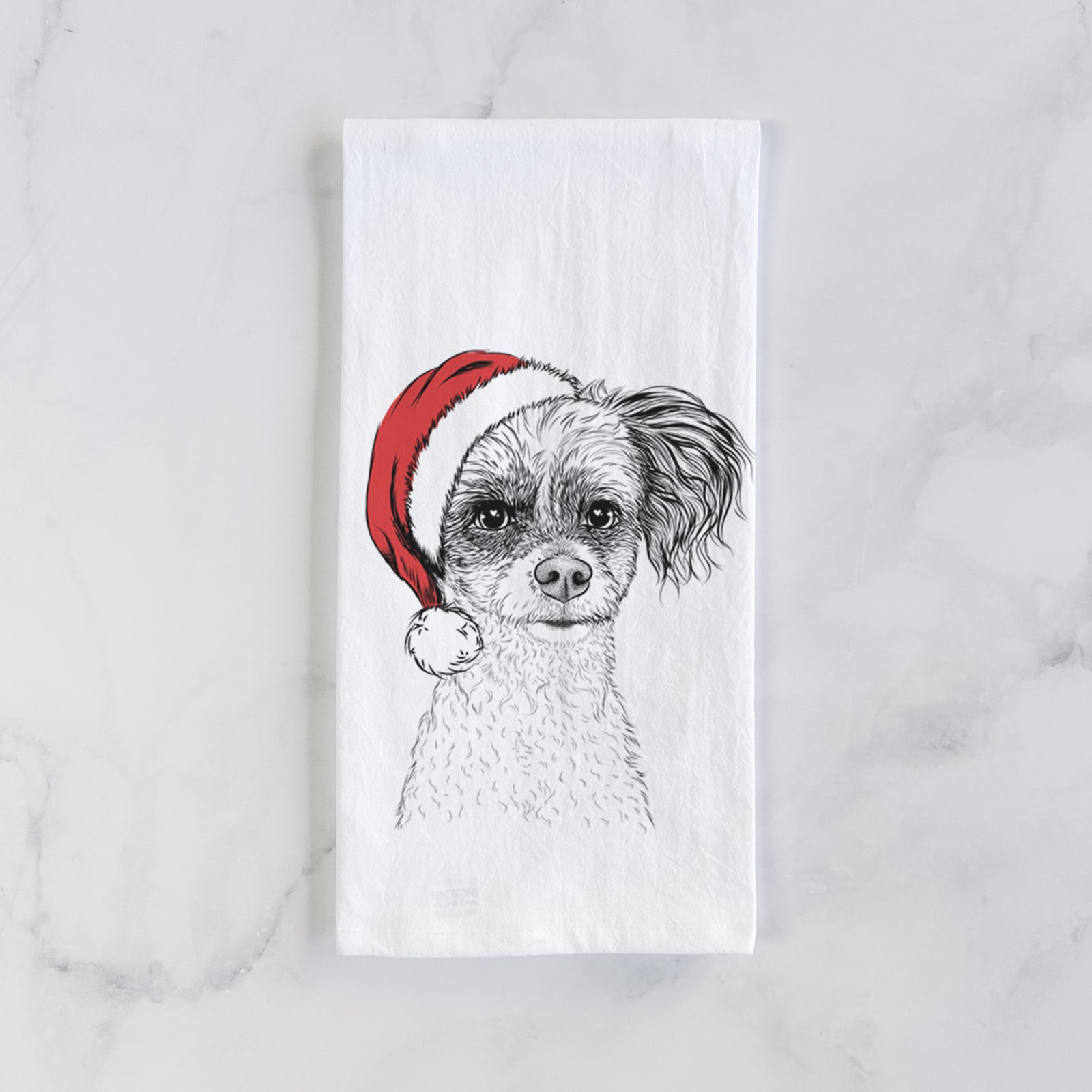 Hand-drawn sketch of Finley the Papillon Mix wearing a Santa hat on a tea towel