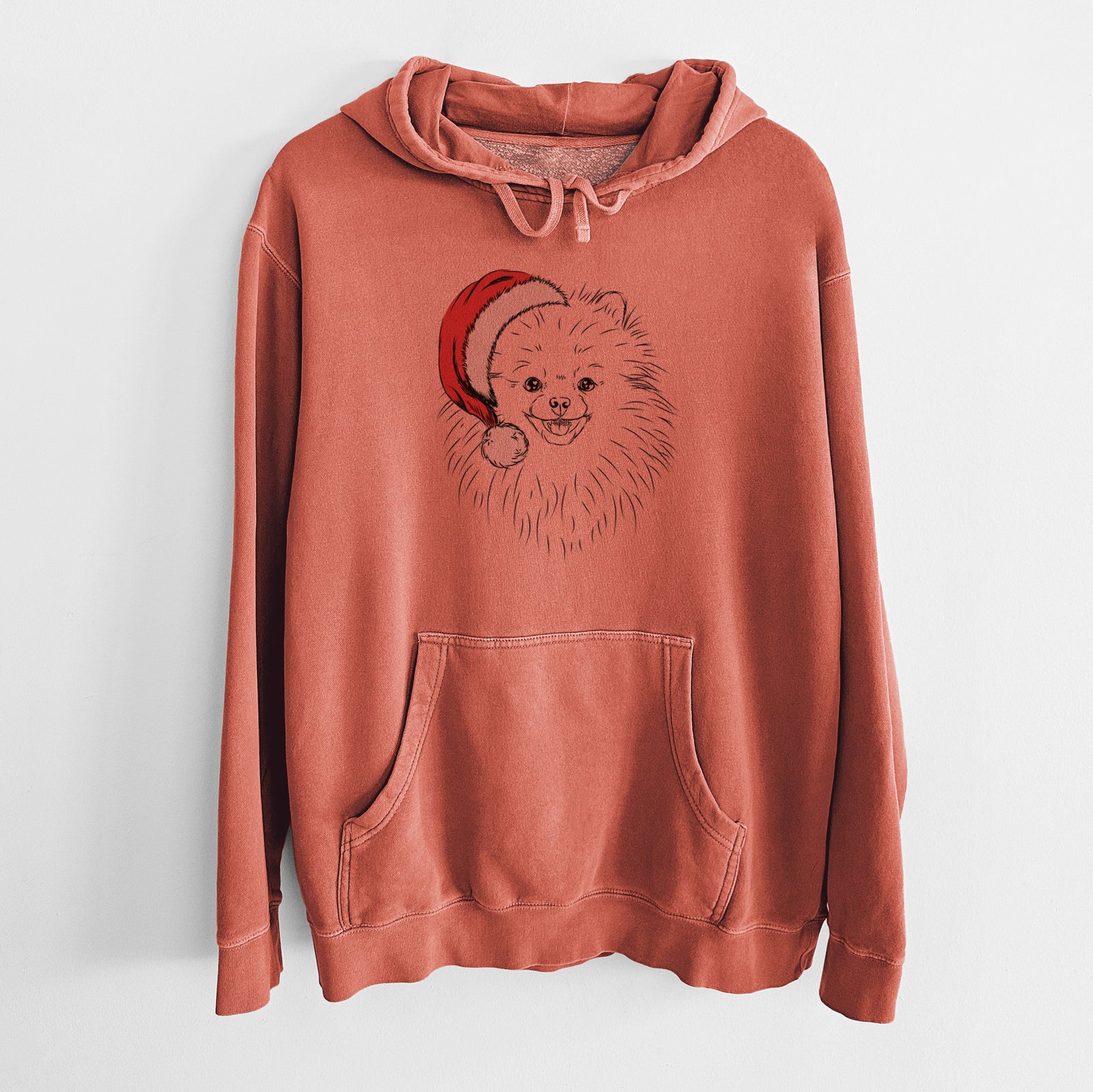 Hand-drawn sketch of Finn the Pomeranian wearing a Santa hat on an Amber Unisex pigment dyed hoodie