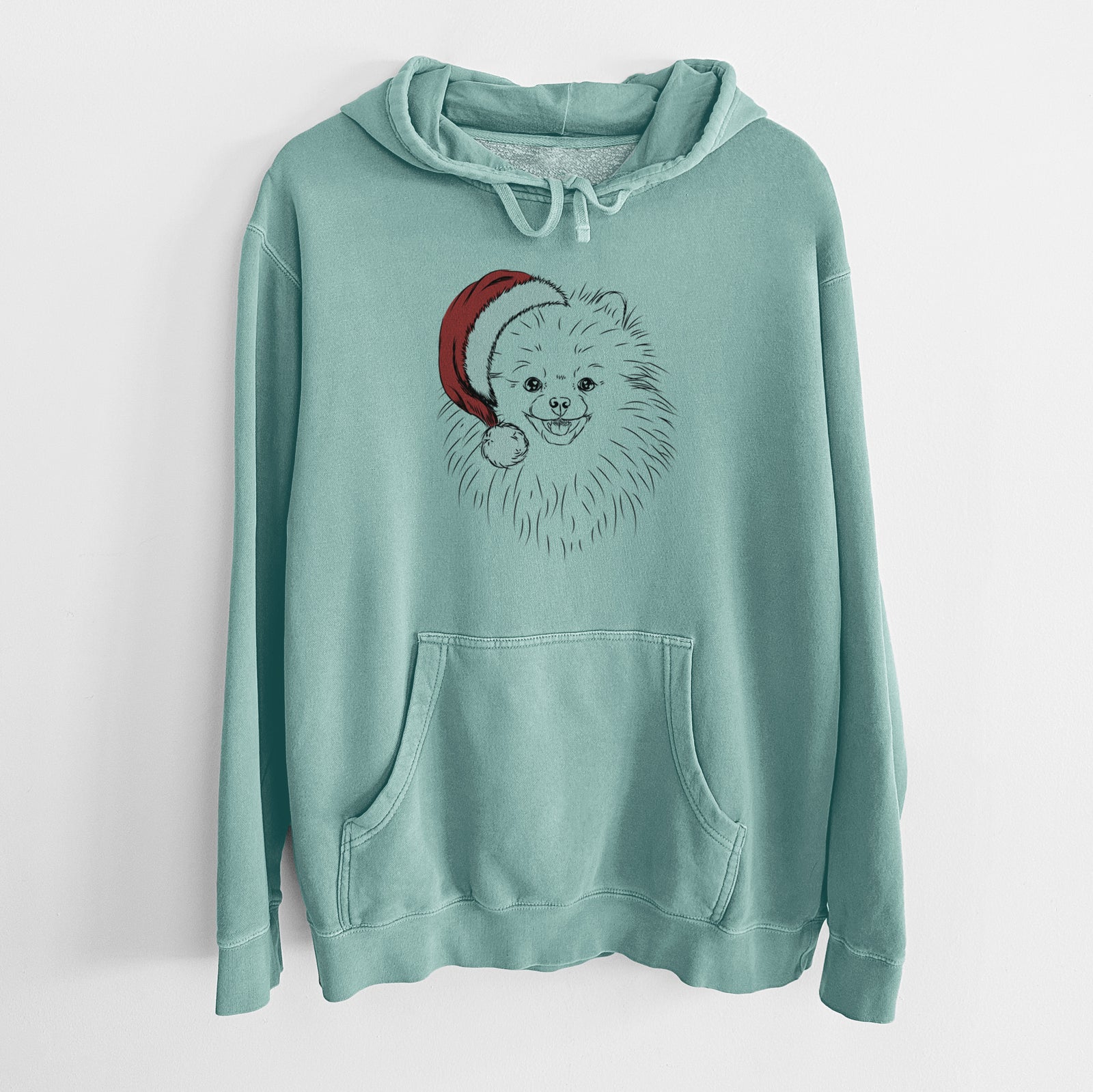 Hand-drawn sketch of Finn the Pomeranian wearing a Santa hat on a Mint Unisex pigment dyed hoodie