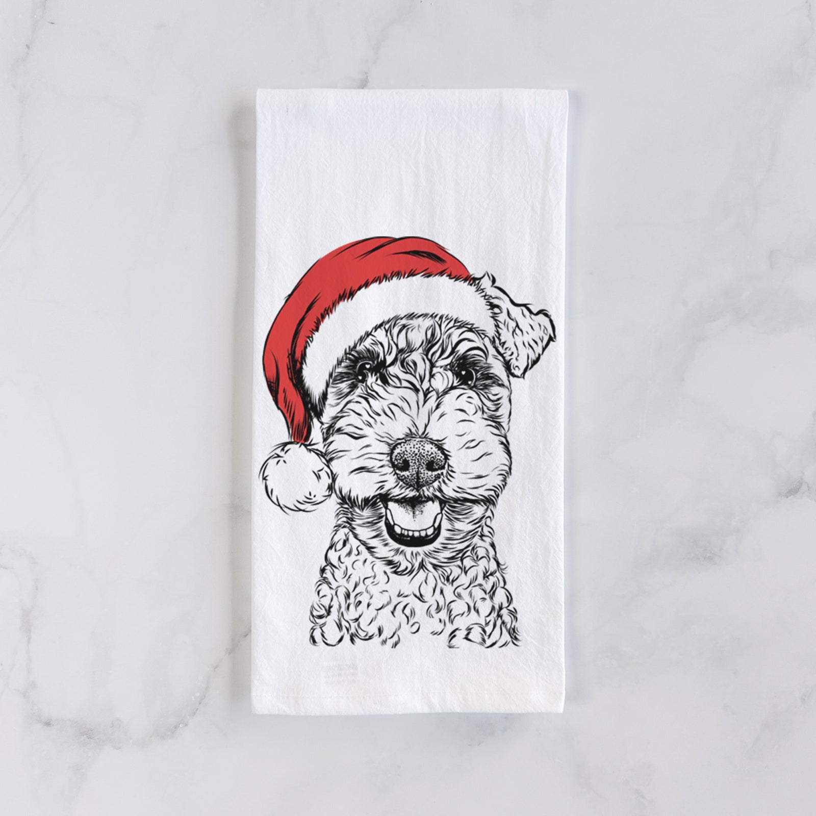 Hand-drawn sketch of Fintan the Irish Troodle wearing a Santa hat on a tea towel