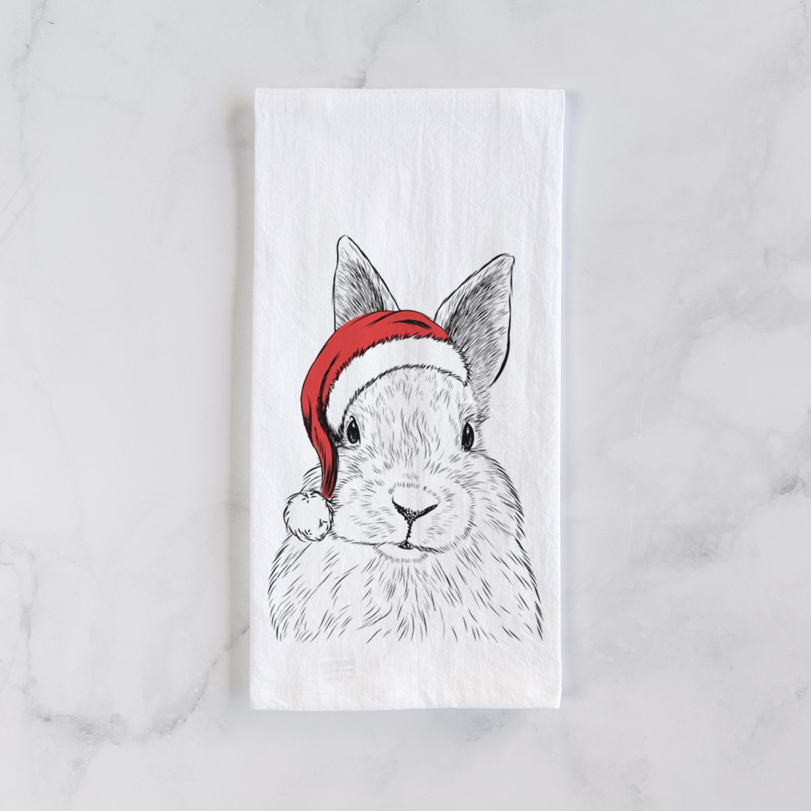 Hand-drawn sketch of Flower the Rex Rabbit wearing a Santa hat on a tea towel