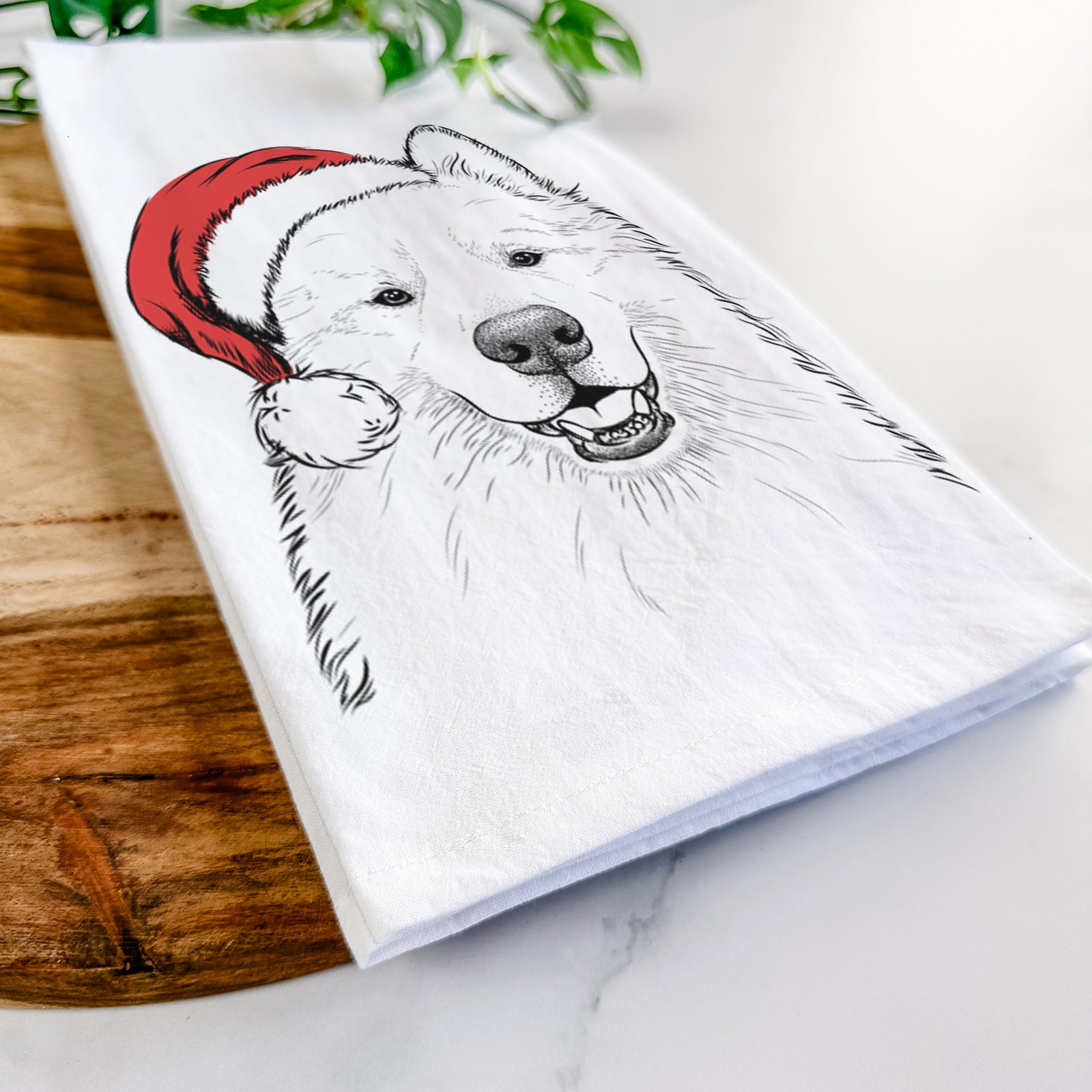 Hand-drawn sketch of Foster the Samoyed wearing a Santa hat on a tea towel