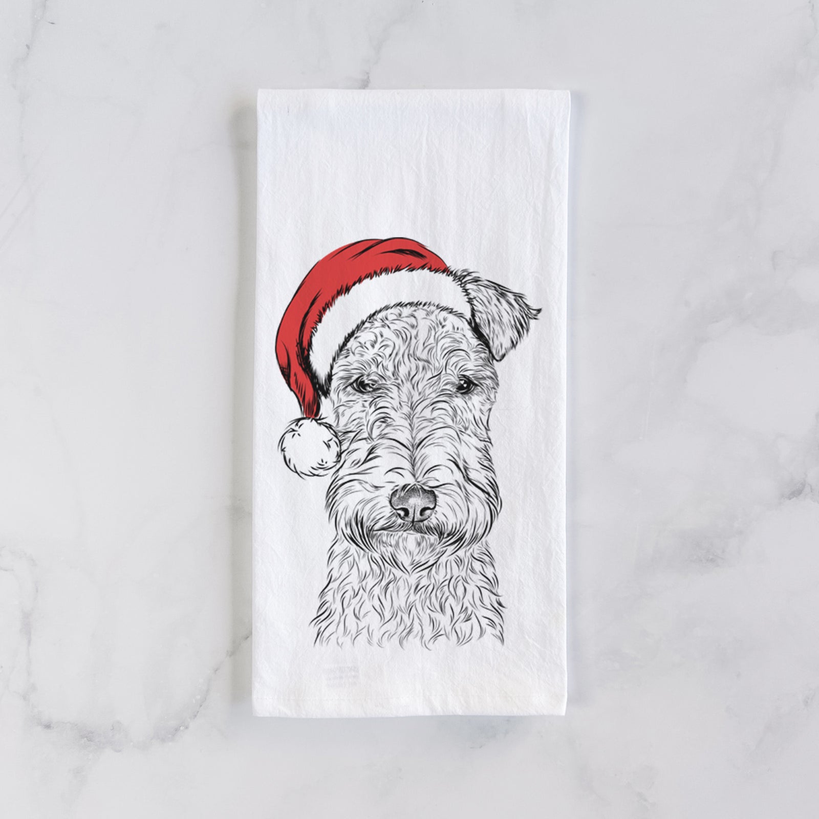 Hand-drawn sketch of Frida the Lakeland Terrier wearing a Santa hat on a tea towel