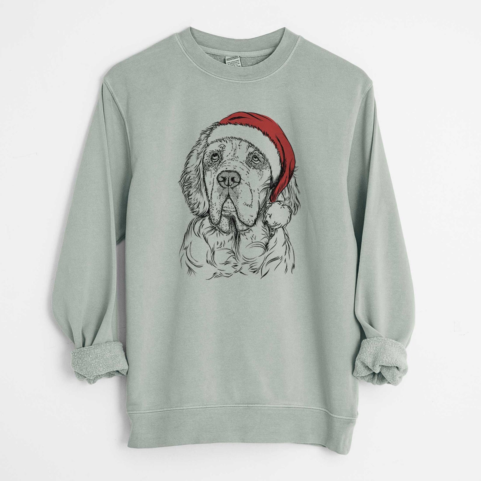 Hand-drawn sketch of Gary the Clumber Spaniel wearing a Santa hat on a Sage Unisex pigment dyed crew sweatshirt