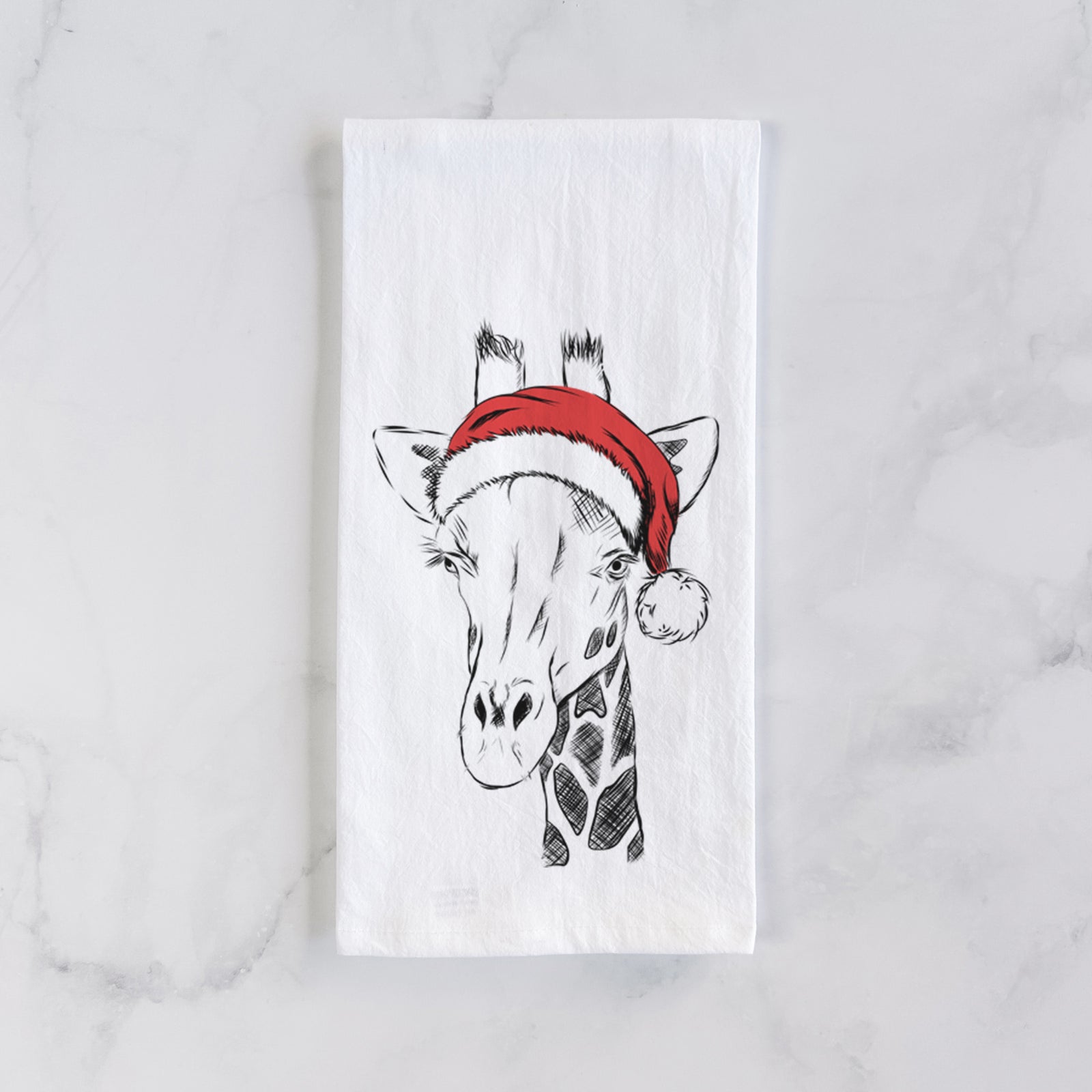 Hand-drawn sketch of Geoffrey the Giraffe wearing a Santa hat on a tea towel