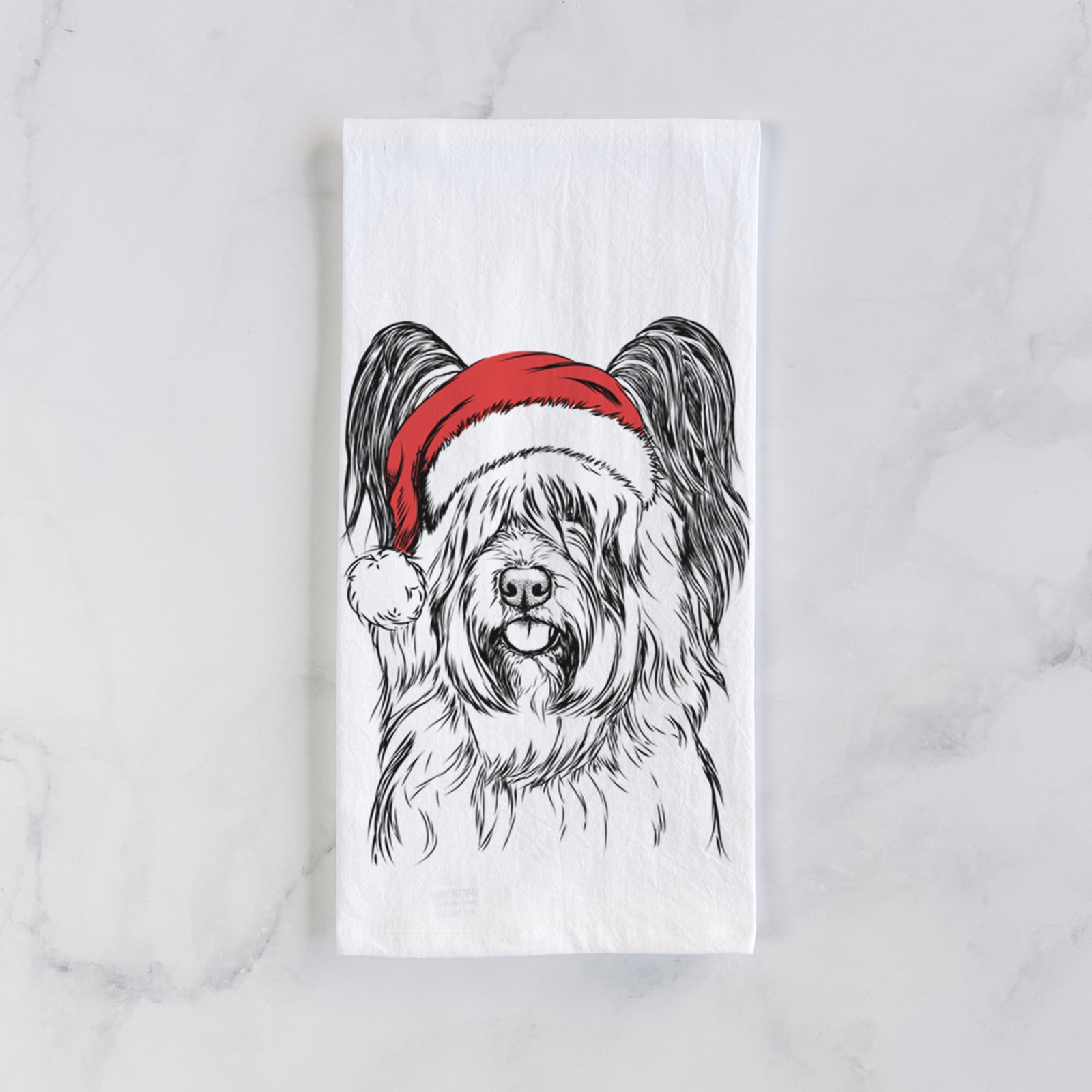 Hand-drawn sketch of Gideon the Skye Terrier wearing a Santa hat on a tea towel