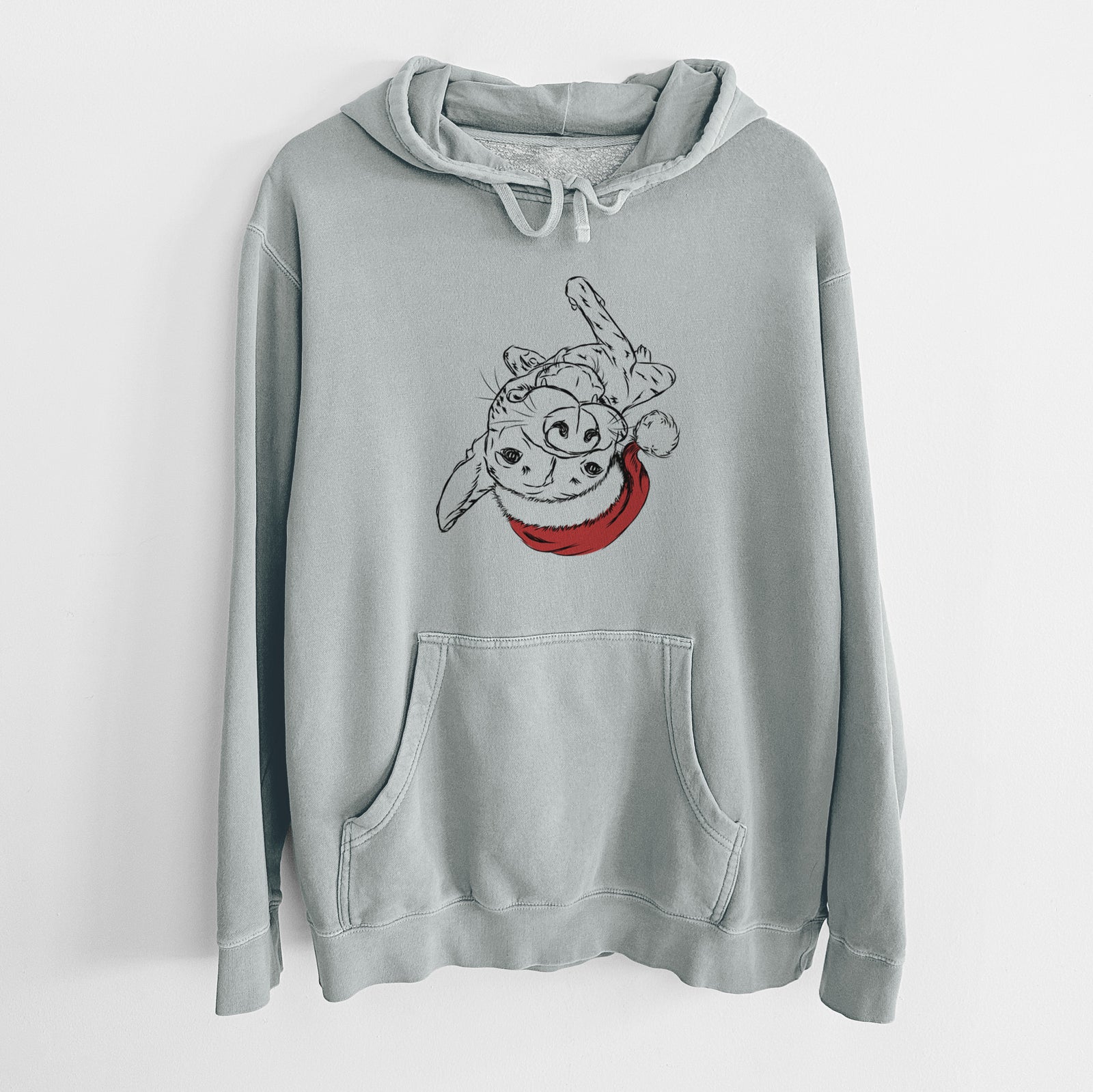 Hand-drawn sketch of Goose the Mixed Breed wearing a Santa hat on a Sage Unisex pigment dyed hoodie