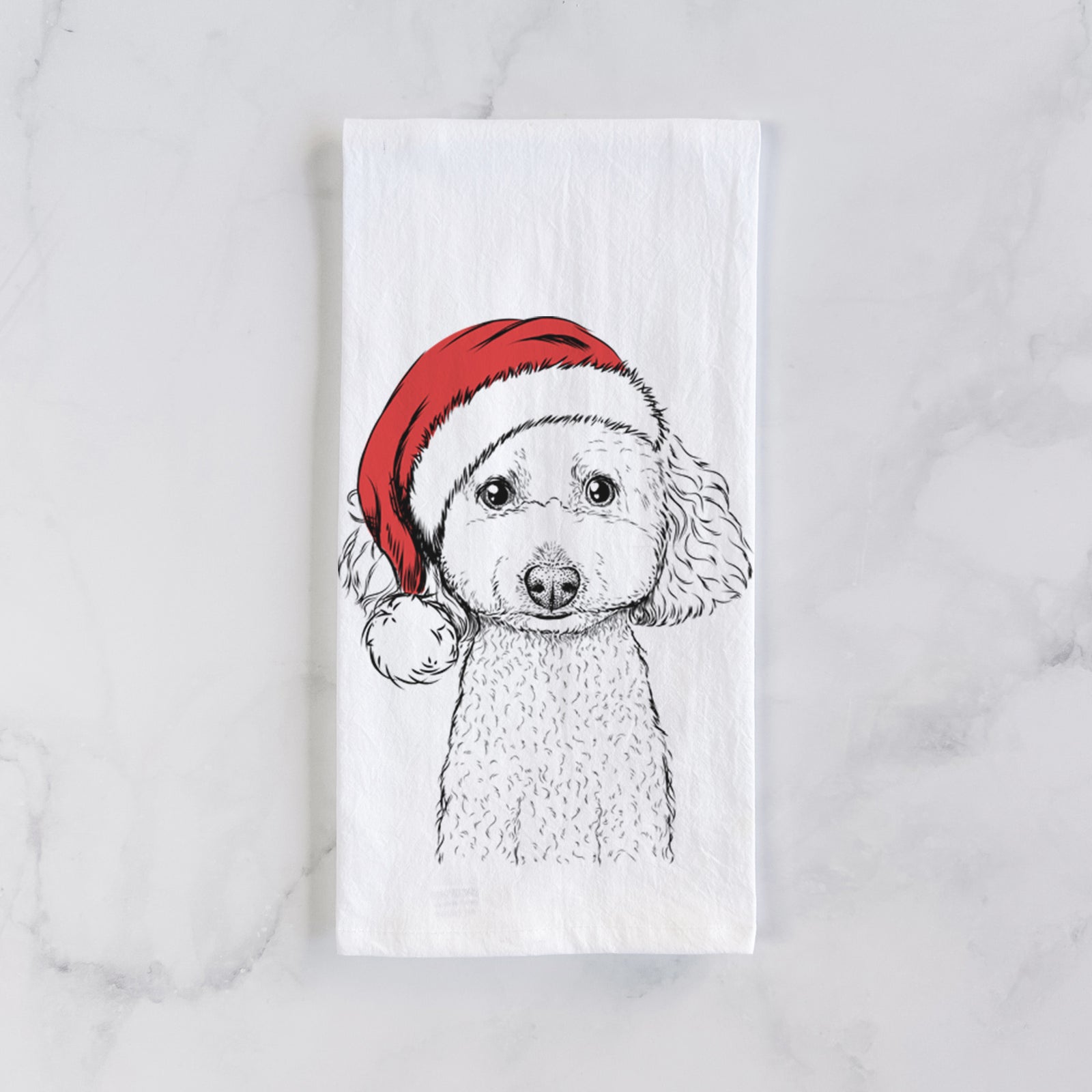 Hand-drawn sketch of Guinness the Toy Poodle Mix wearing a Santa hat on a tea towel