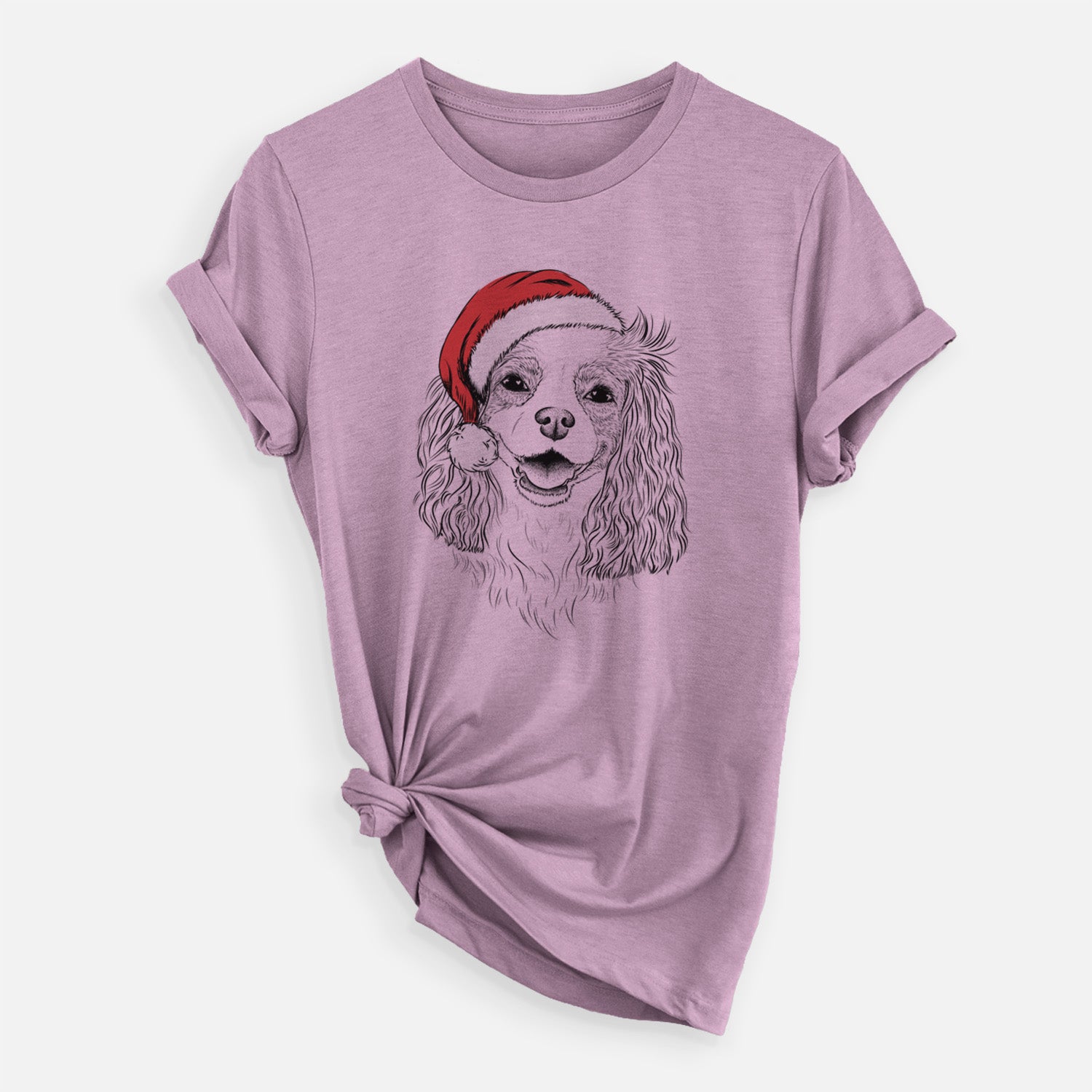 Hand-drawn sketch of Halley Comet the Cavalier King Charles Spaniel wearing a Santa hat on an Orchid Unisex crewneck, worn by a woman