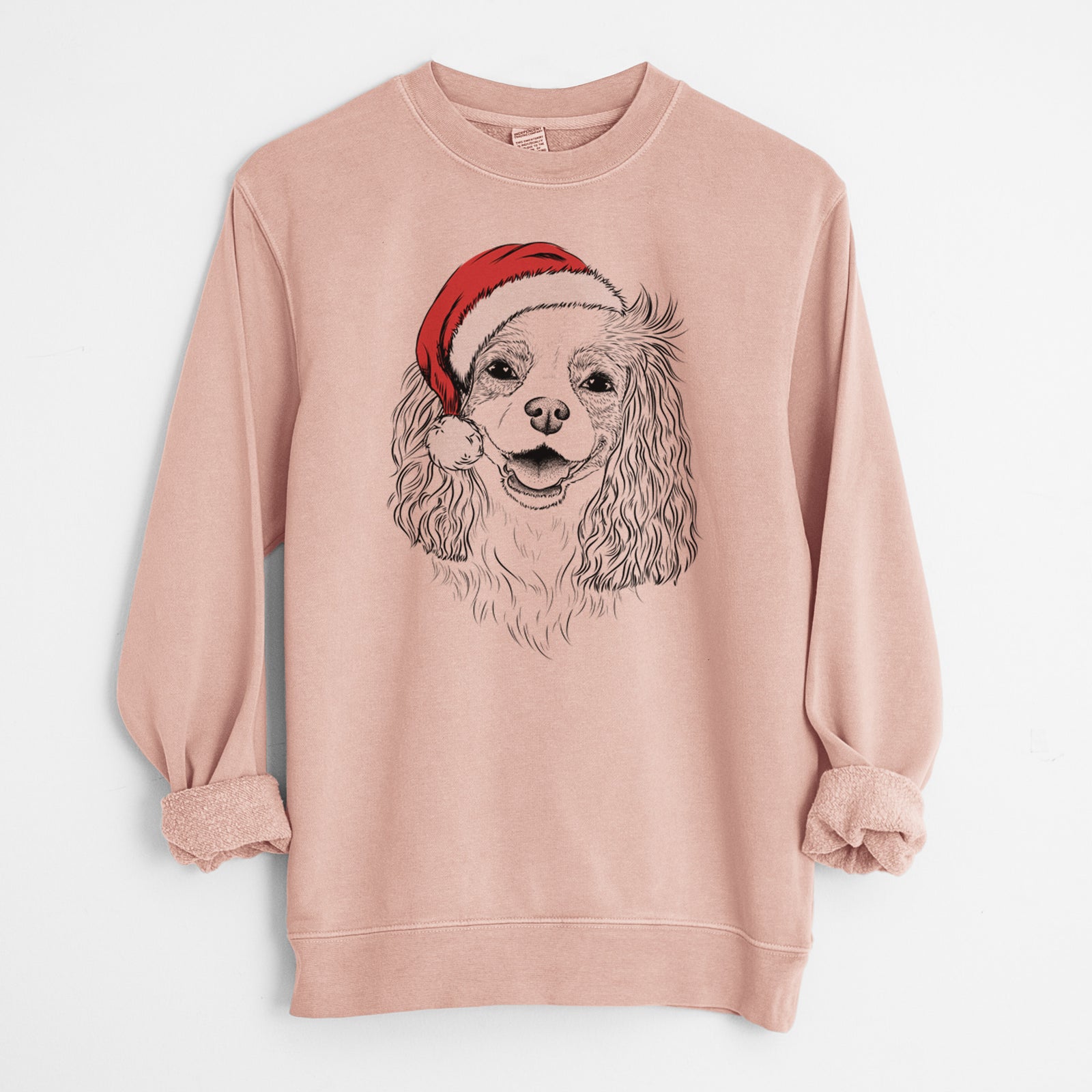 Hand-drawn sketch of Halley Comet the Cavalier King Charles Spaniel wearing a Santa hat on a Dusty Pink Unisex pigment dyed crew sweatshirt