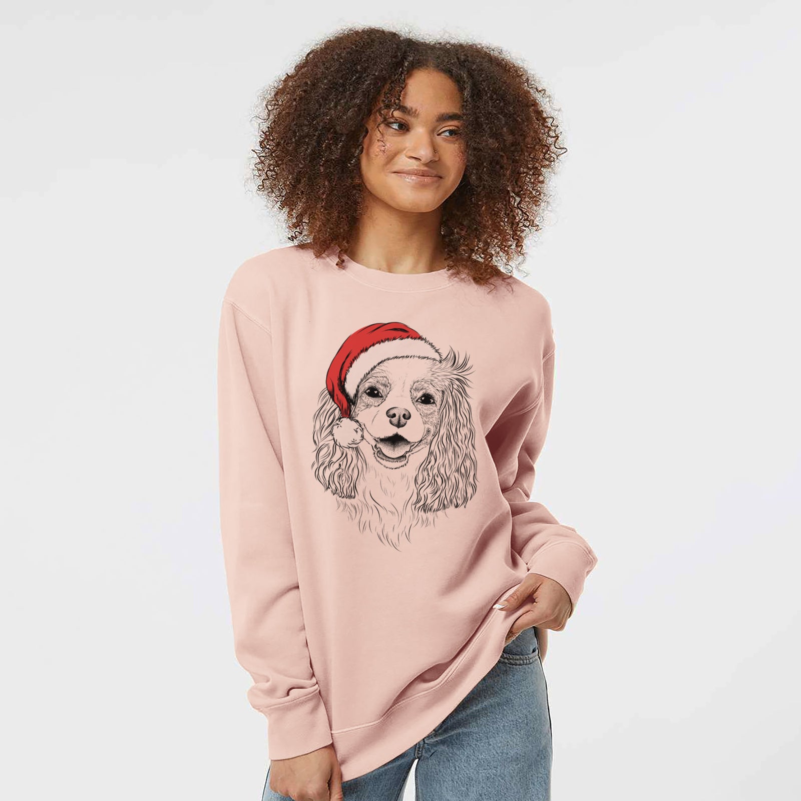 Hand-drawn sketch of Halley Comet the Cavalier King Charles Spaniel wearing a Santa hat on a Dusty Pink Unisex pigment dyed crew sweatshirt