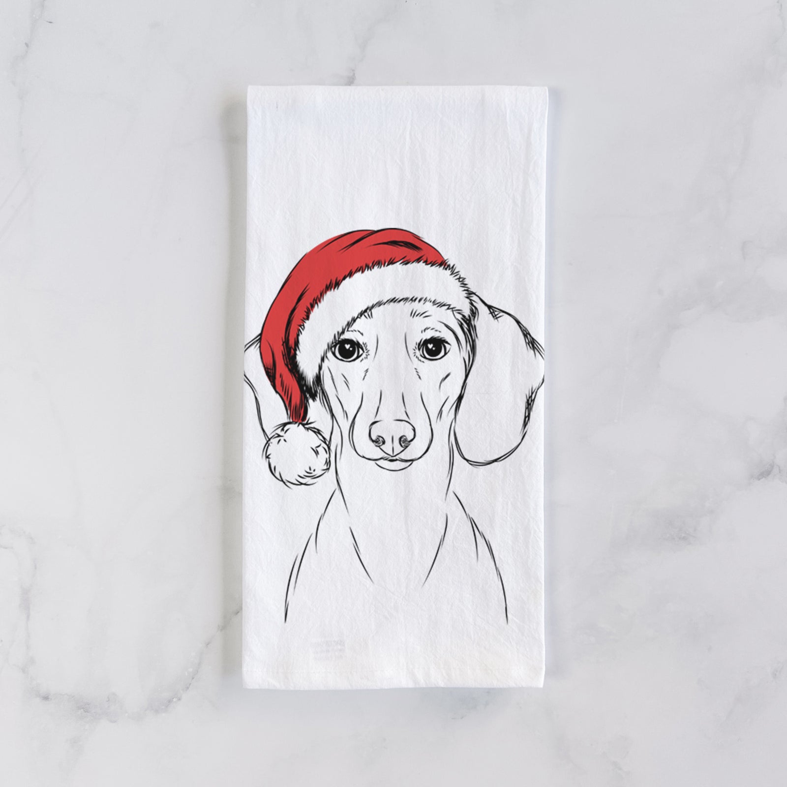 Hand-drawn sketch of Hans the Dachshund wearing a Santa hat on a tea towel