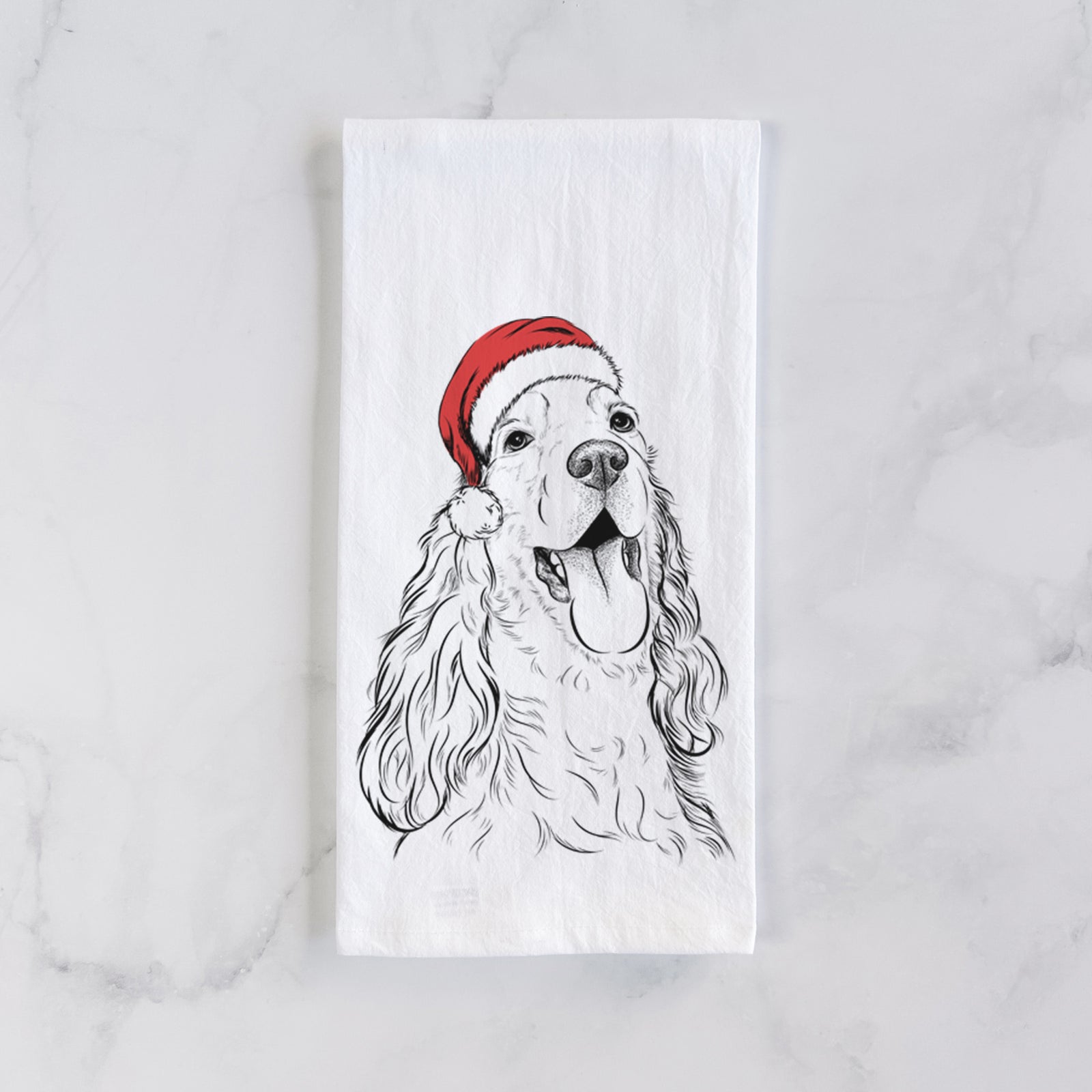 Hand-drawn sketch of Happy Henry the English Cocker Spaniel wearing a Santa hat on a tea towel