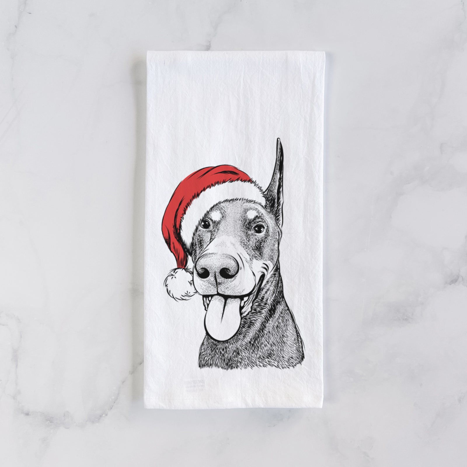 Hand-drawn sketch of Happy Sunny the Doberman Pinscher wearing a Santa hat on a tea towel