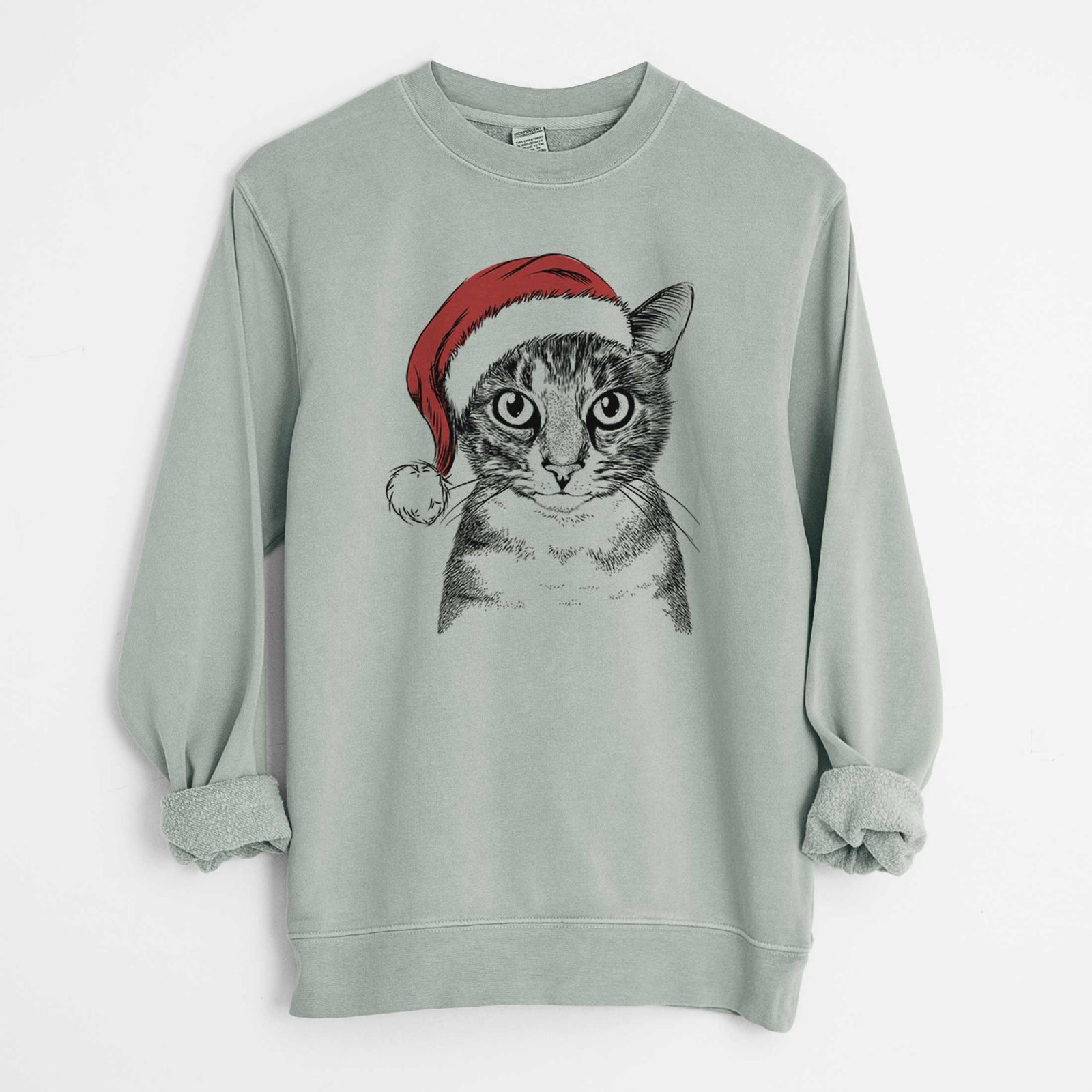 Hand-drawn sketch of Hobbes the Tabby Cat wearing a Santa hat on a Sage Unisex pigment dyed crew sweatshirt