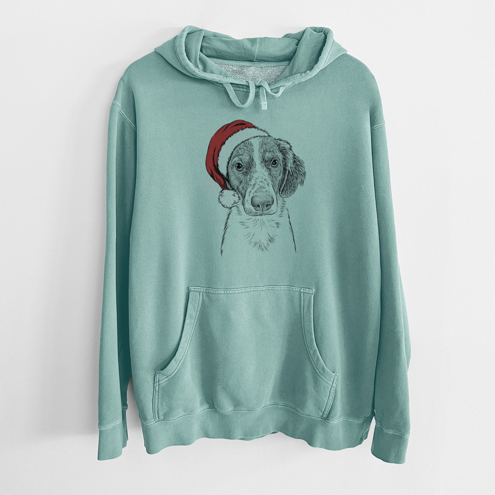 Hand-drawn sketch of Holly the Brittany Spaniel wearing a Santa hat on a Mint Unisex pigment dyed hoodie