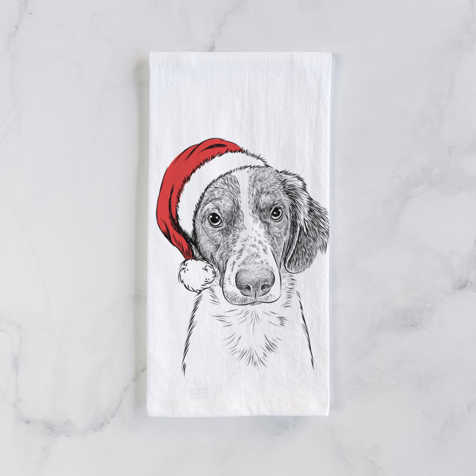 Hand-drawn sketch of Holly the Brittany Spaniel wearing a Santa hat on a tea towel