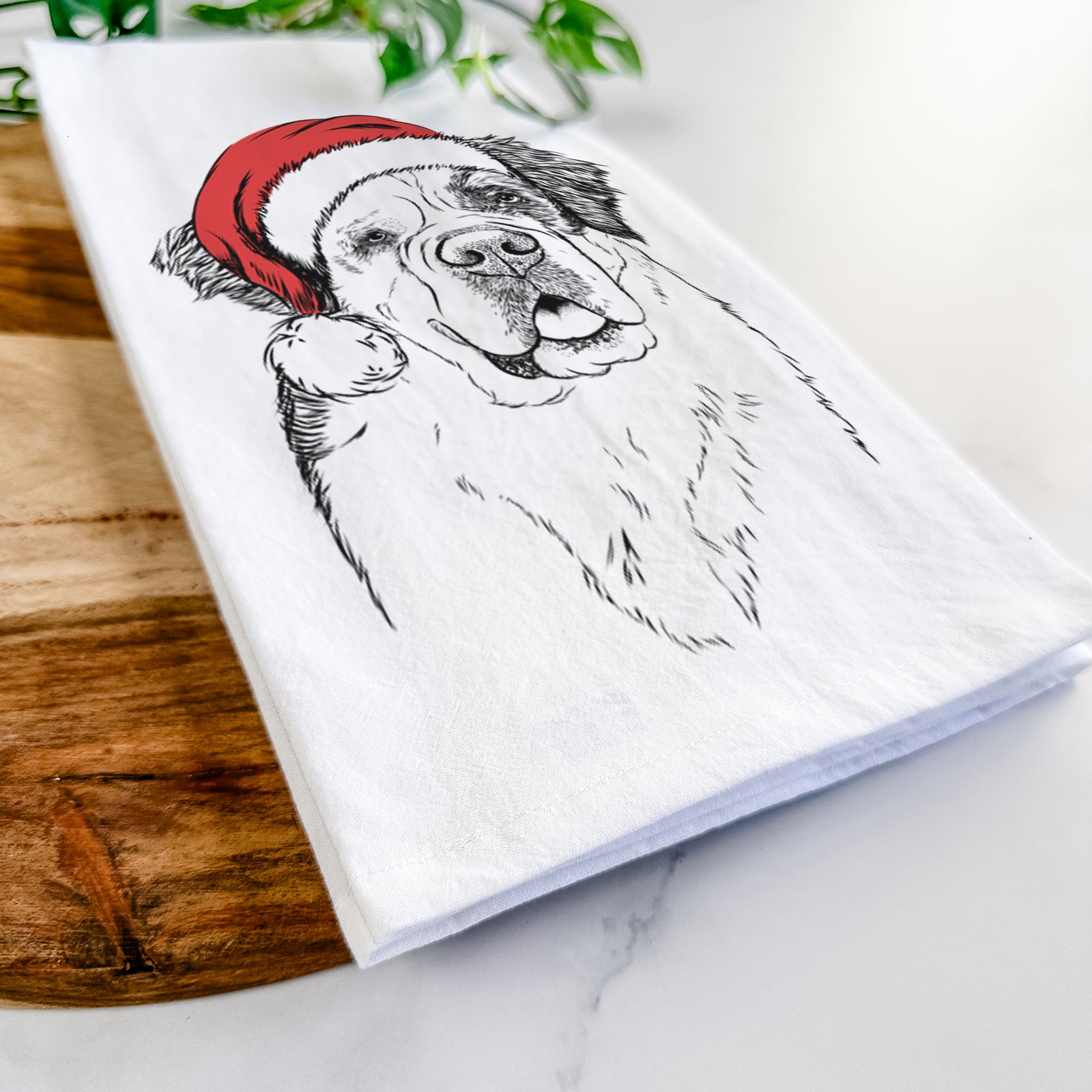 Hand-drawn sketch of Hook the Saint Bernard wearing a Santa hat on a tea towel
