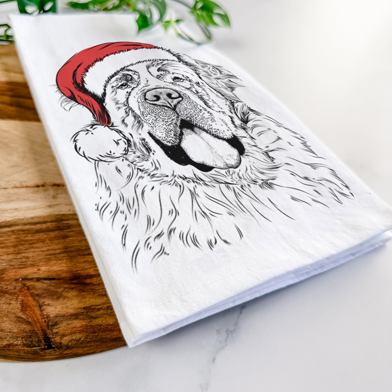 Hand-drawn sketch of Hoss the Saint Bernard wearing a Santa hat on a tea towel
