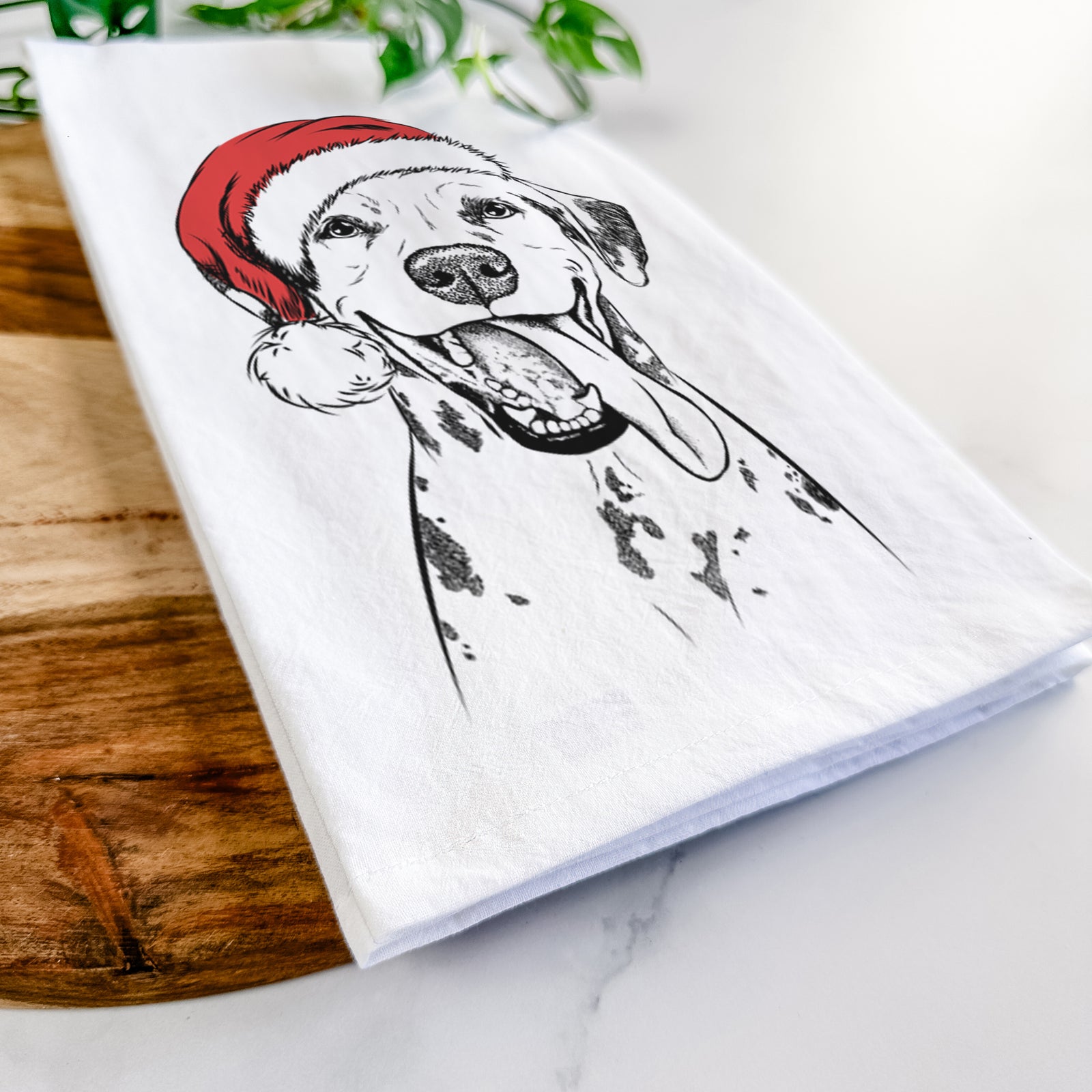 Hand-drawn sketch of Hydro the Dalmatian wearing a Santa hat on a tea towel