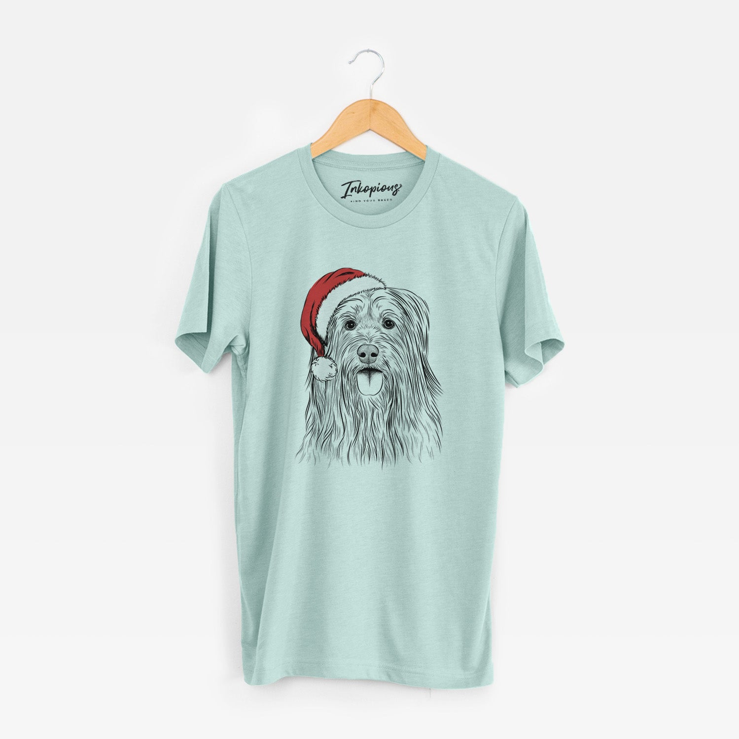 Hand-drawn sketch of Indy the Korean Sapsali wearing a Santa hat on a Heather Sage Unisex crewneck