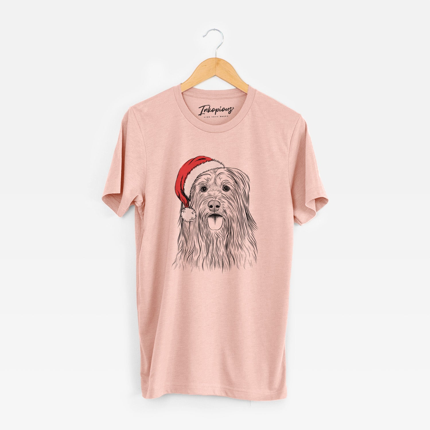 Hand-drawn sketch of Indy the Korean Sapsali wearing a Santa hat on a Peach Unisex crewneck