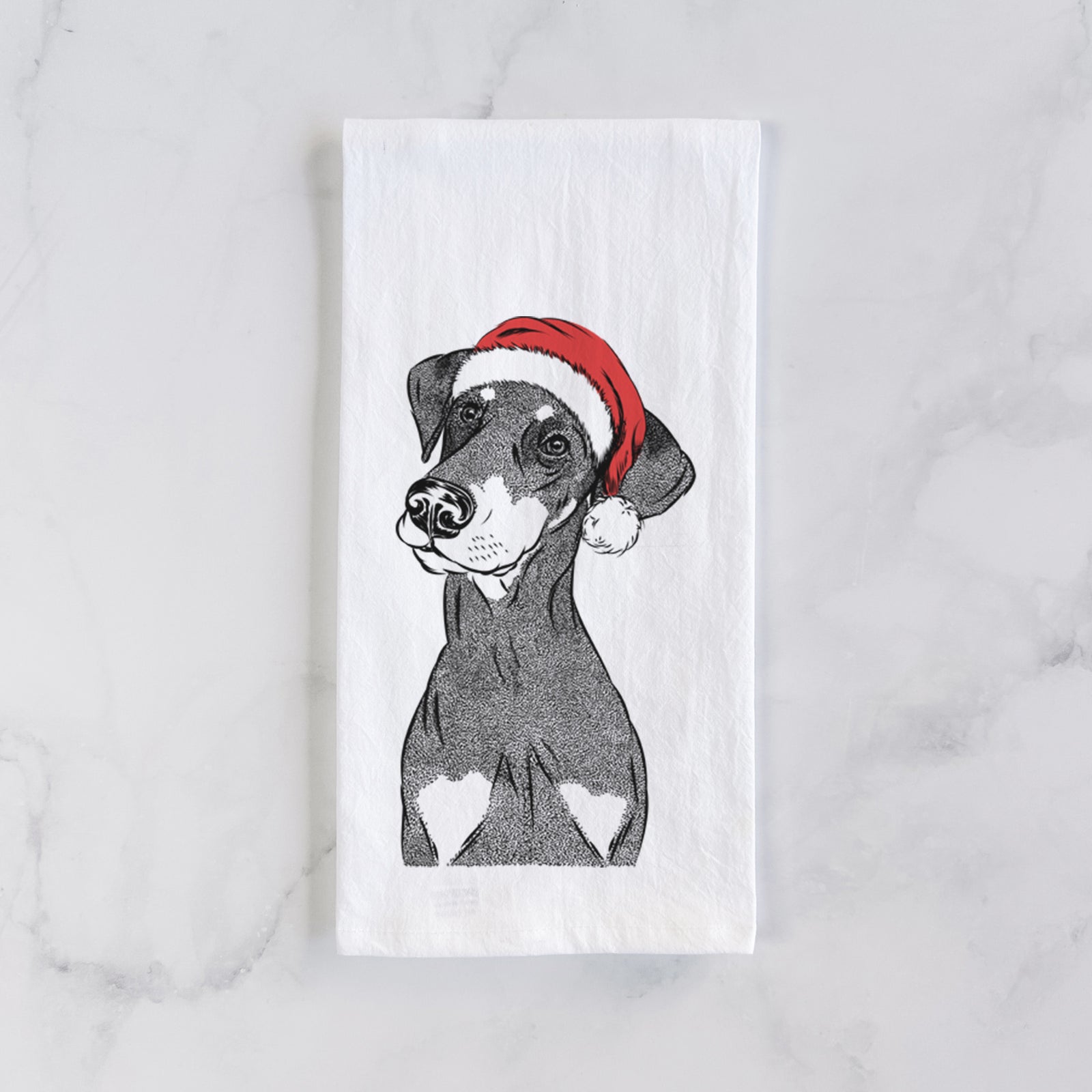 Hand-drawn sketch of Iroh the Doberman Pinscher wearing a Santa hat on a tea towel