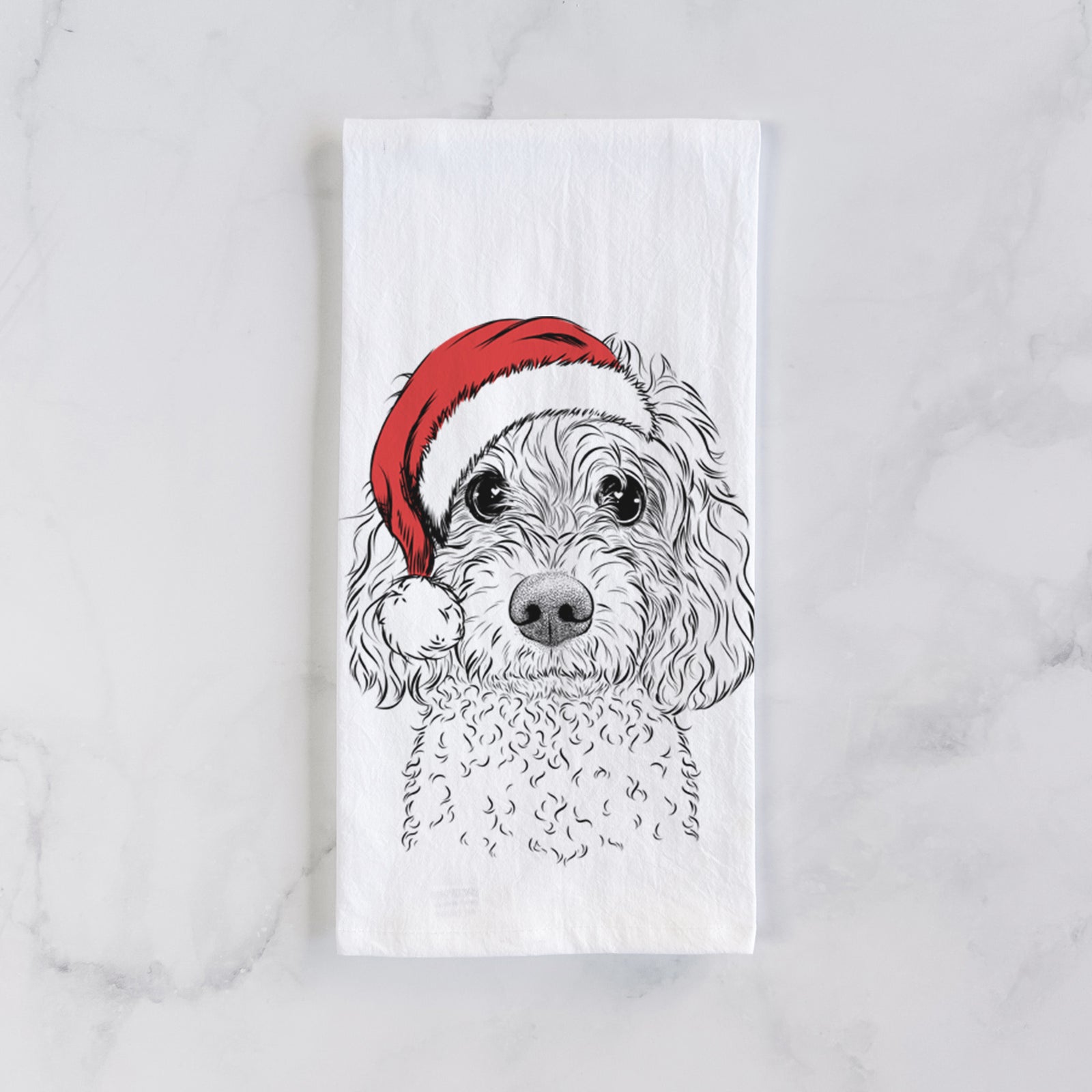 Hand-drawn sketch of Izzie the Cavachon wearing a Santa hat on a tea towel