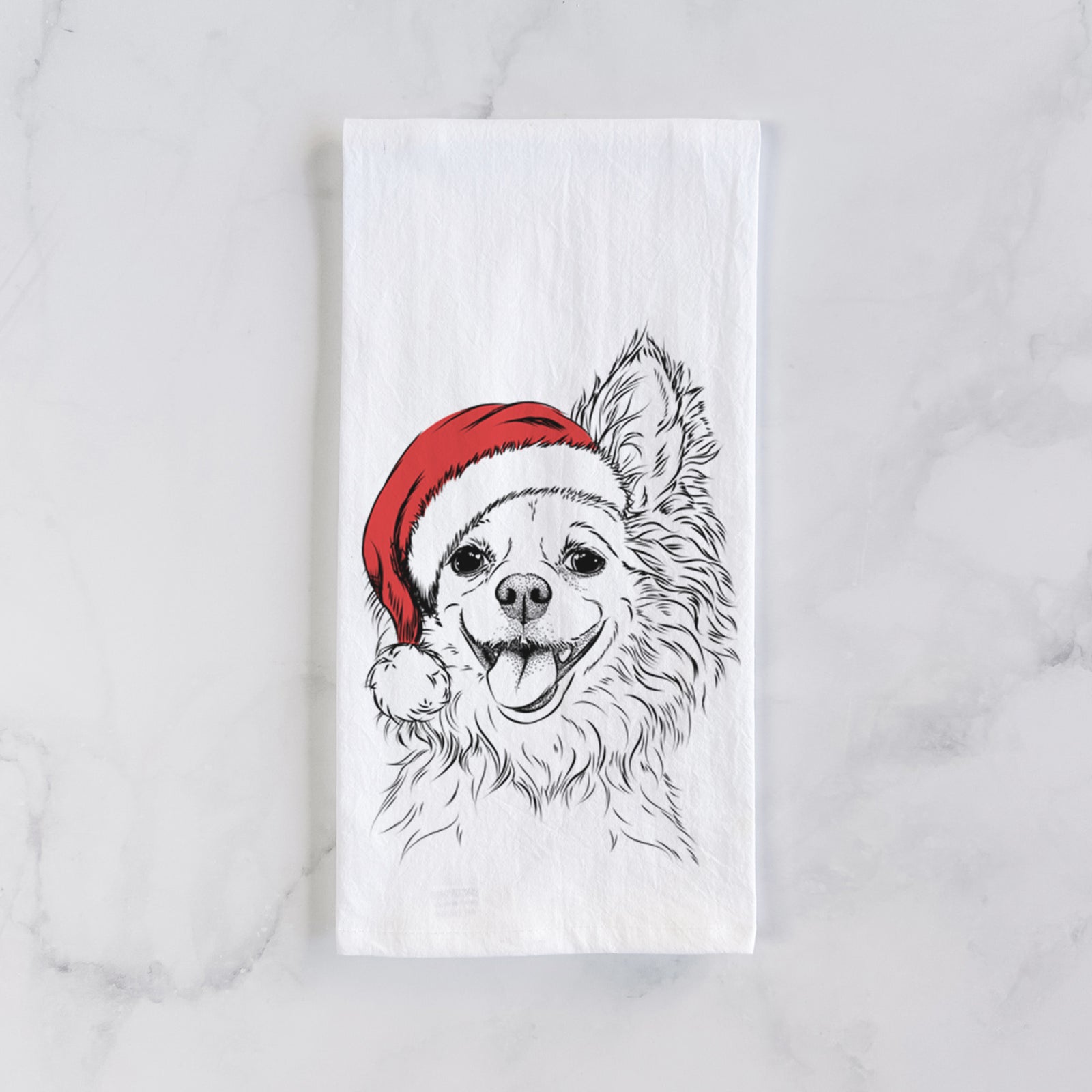 Hand-drawn sketch of Jasper the Pomchi wearing a Santa hat on a tea towel