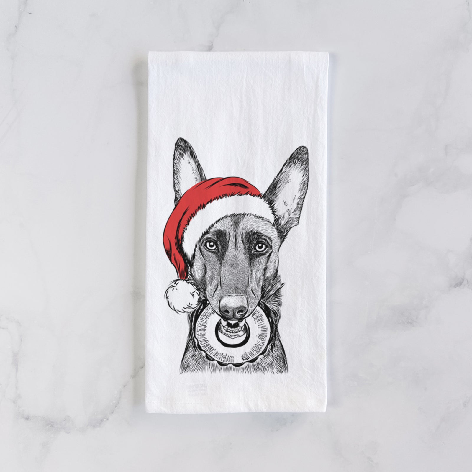 Hand-drawn sketch of Juno the Belgian Malinois wearing a Santa hat on a tea towel