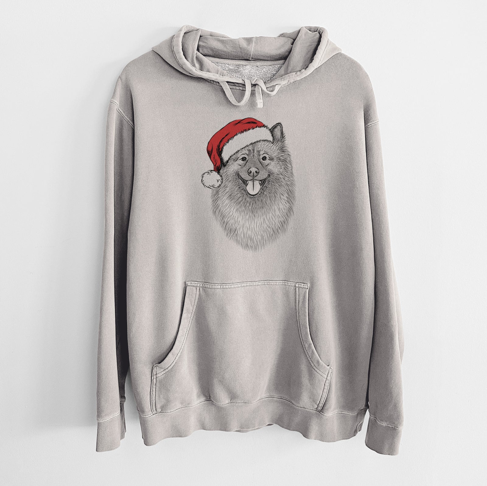 Hand-drawn sketch of Kai the Keeshond wearing a Santa hat on a Cement Unisex pigment dyed hoodie