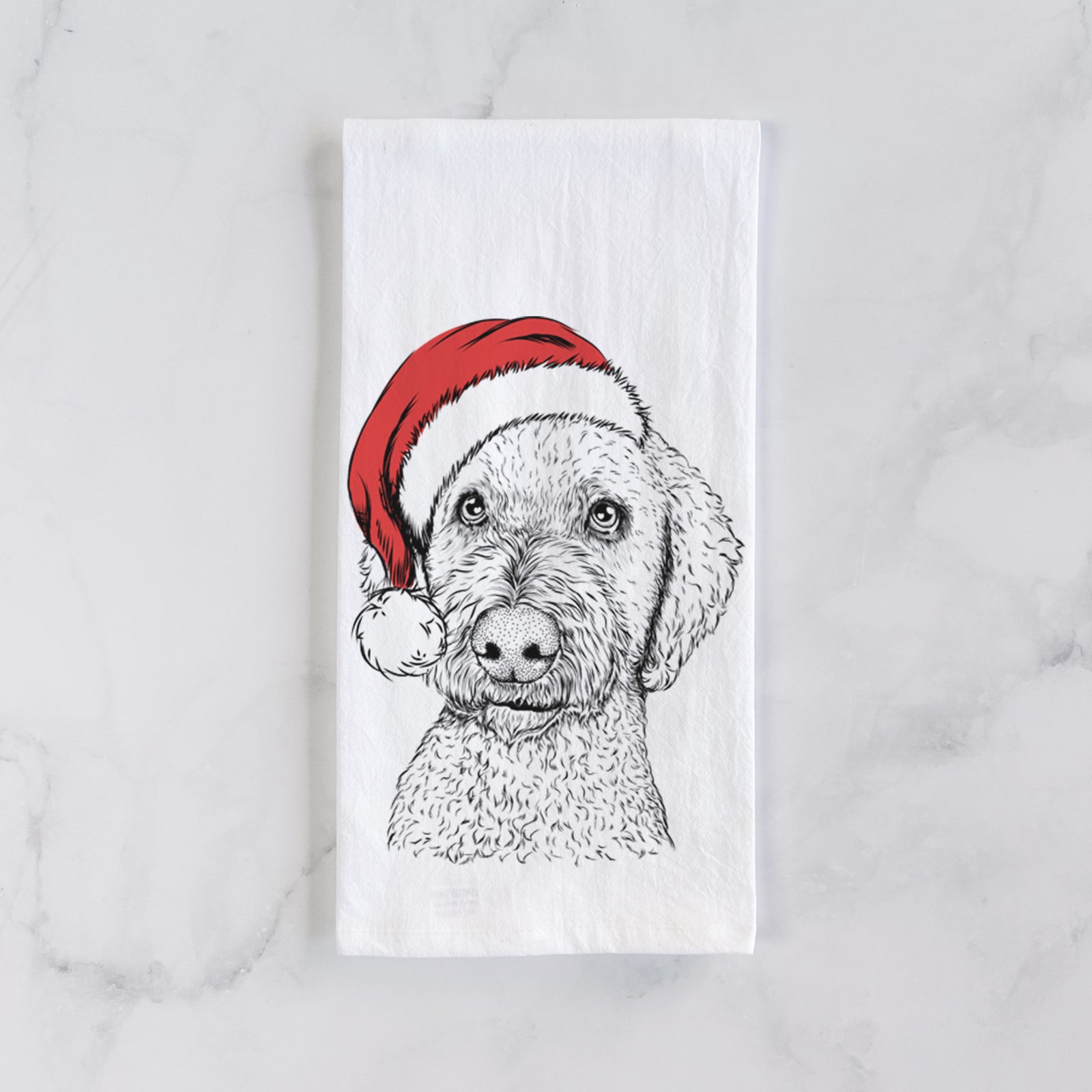 Hand-drawn sketch of Lucy Boo the Goldendoodle wearing a Santa hat on a tea towel
