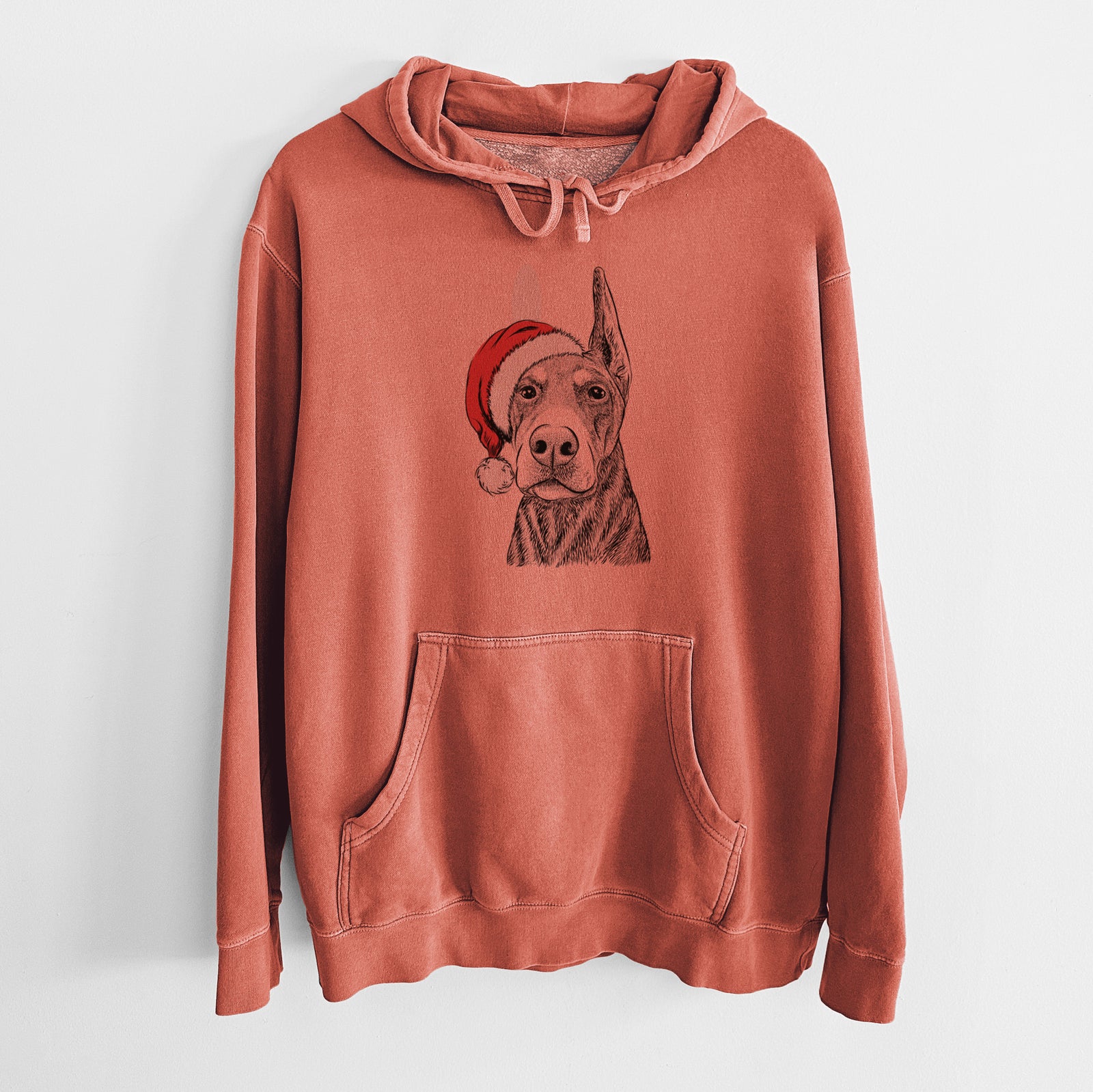 Hand-drawn sketch of Luna the Doberman Pinscher wearing a Santa hat on an Amber Unisex pigment dyed hoodie