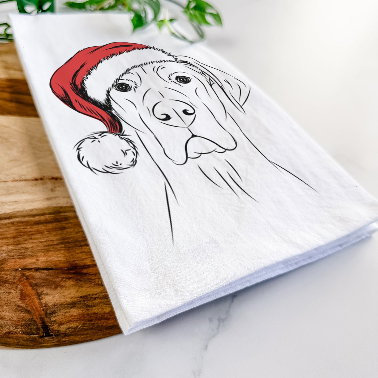 Hand-drawn sketch of Maddox the Great Dane wearing a Santa hat on a tea towel